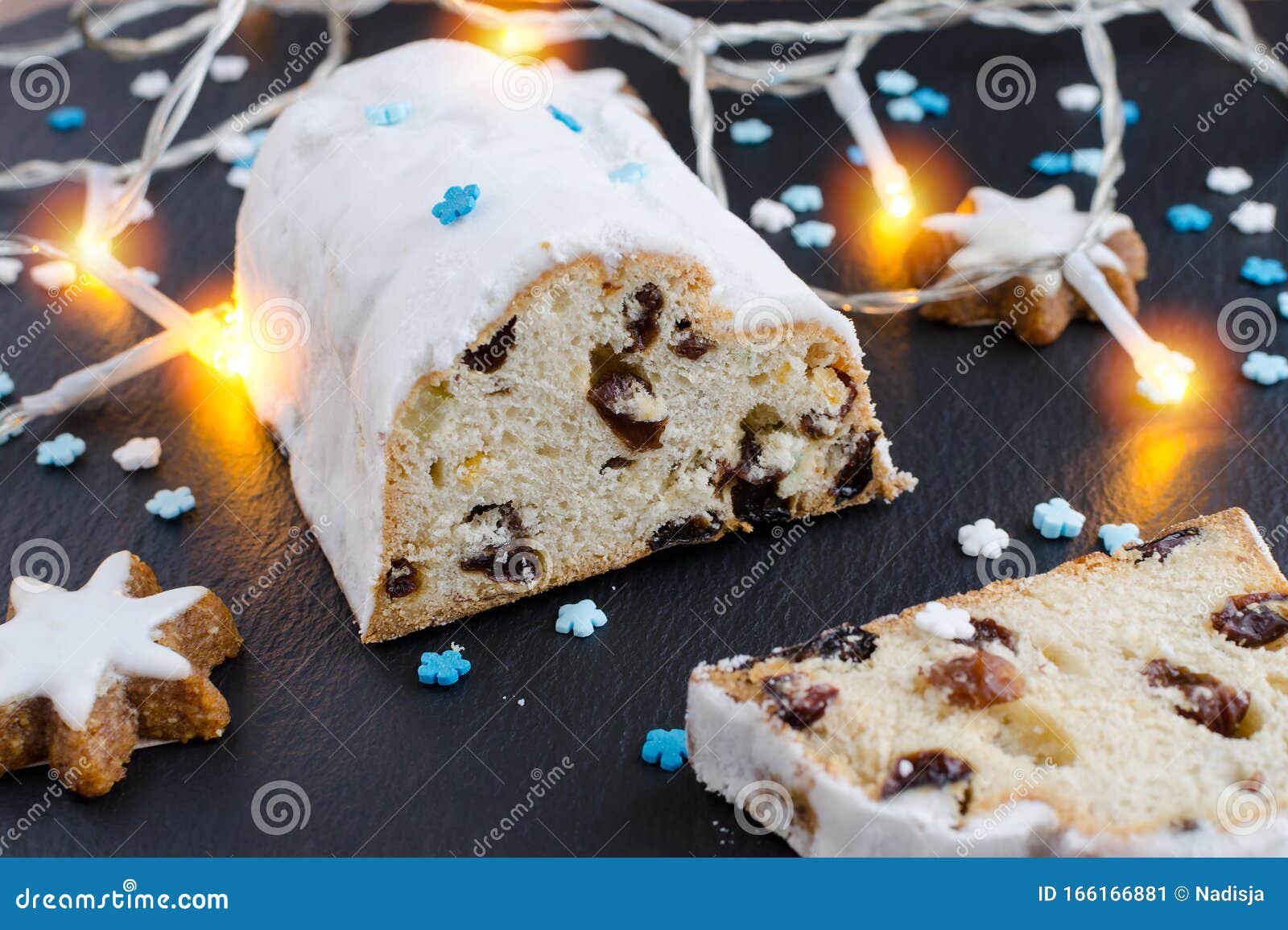 Traditional German Christmas Cake Stollen with Cookies and Decoration