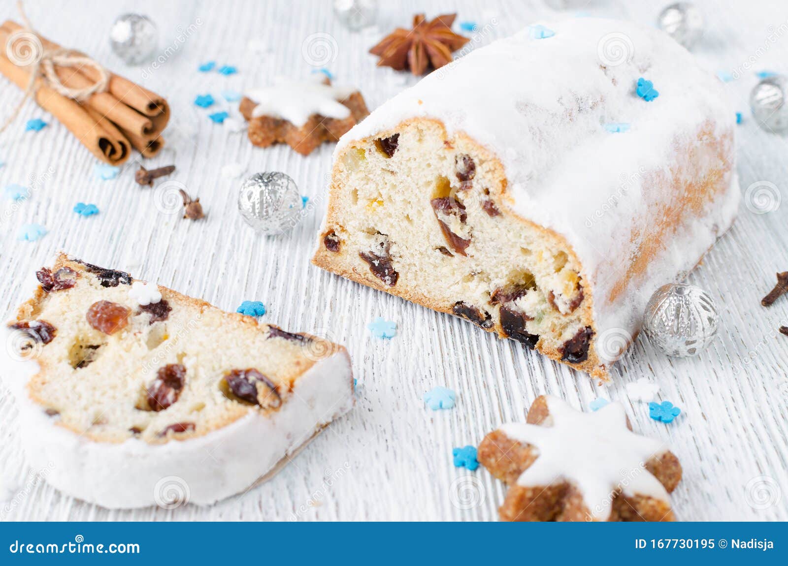 Traditional German Christmas Cake Stollen with Cookies and Decoration