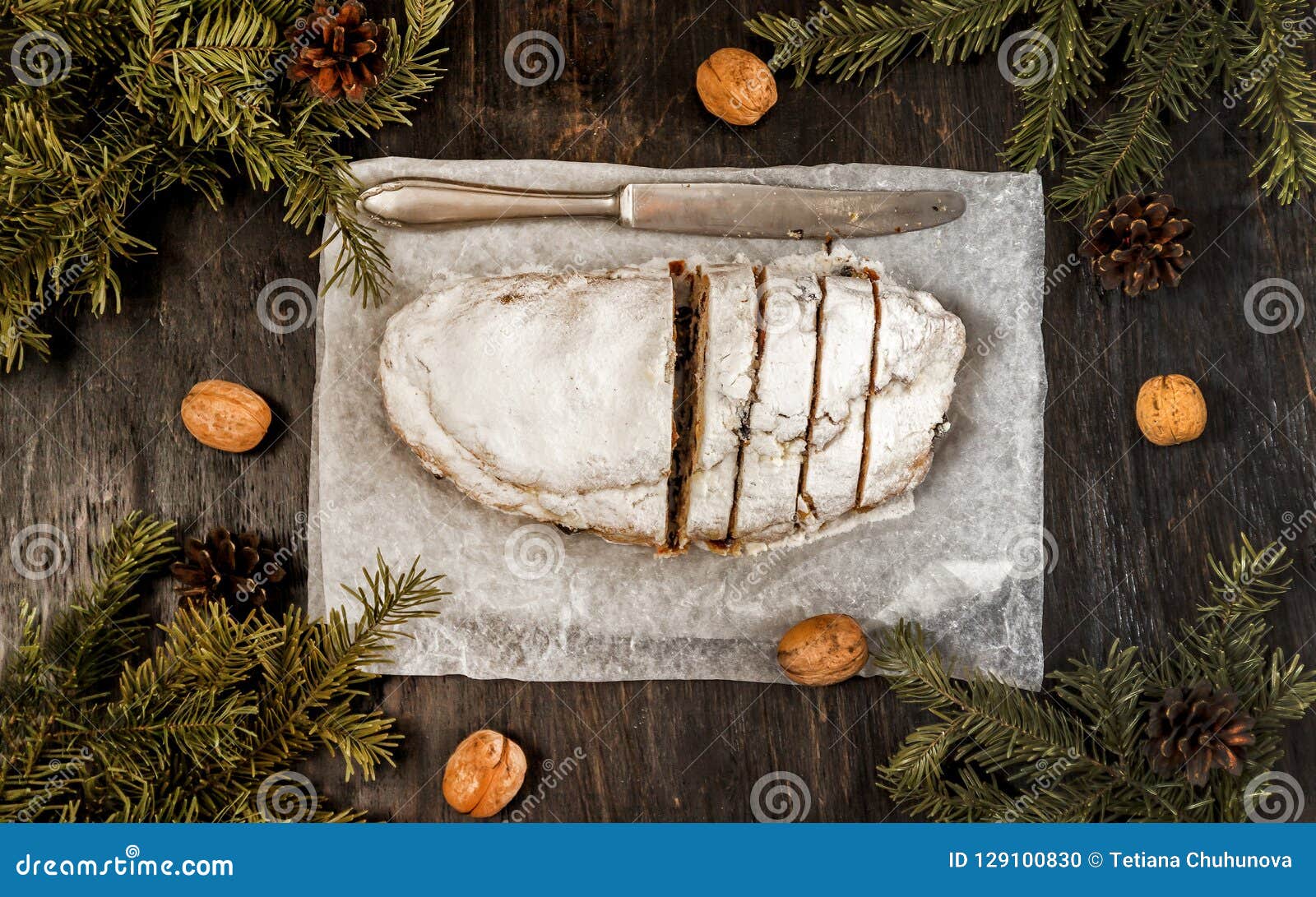 Traditional German Christmas Fruit Cake Stollen on a Dark Background