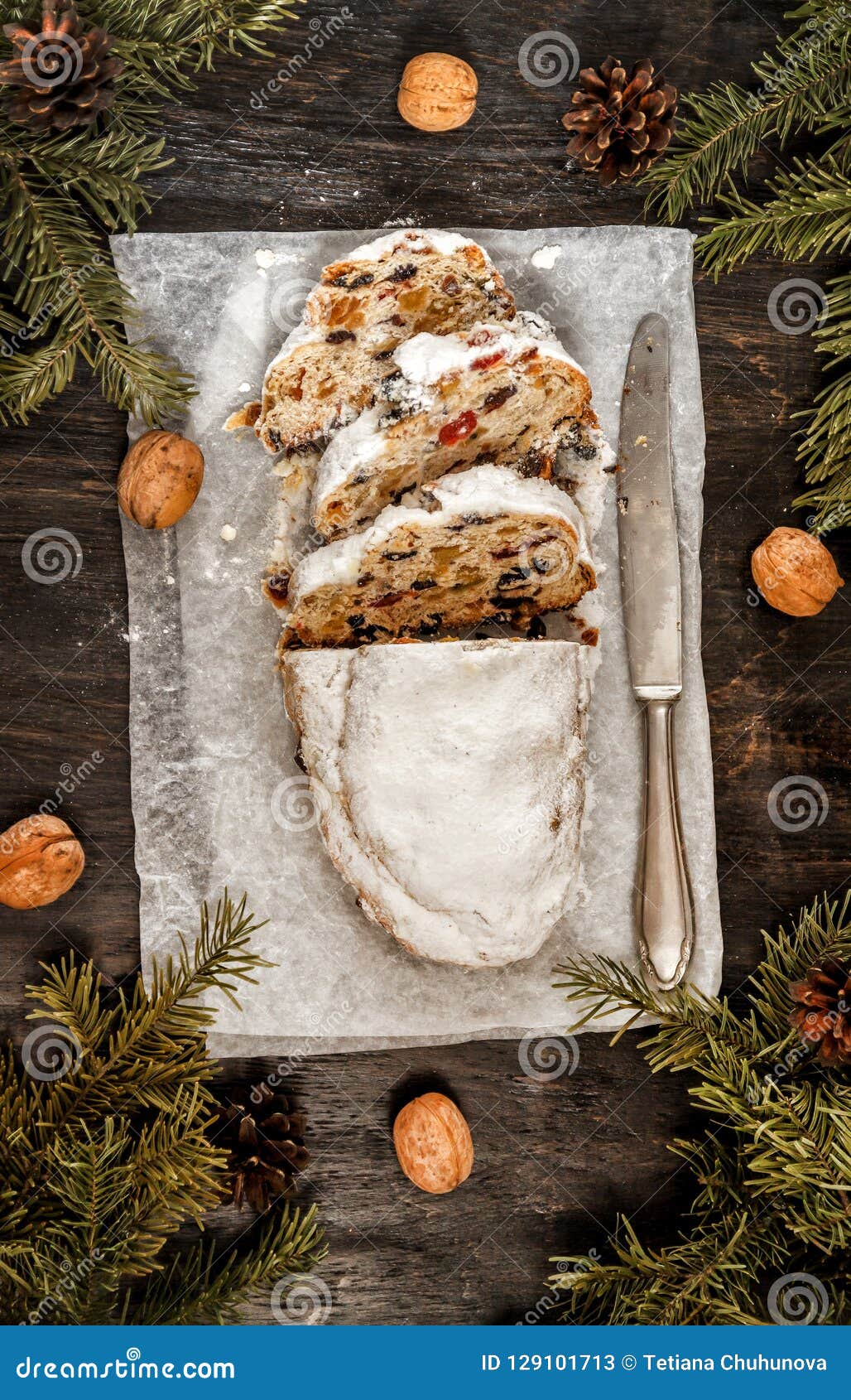 Traditional German Christmas Fruit Cake Stollen on a Dark Background