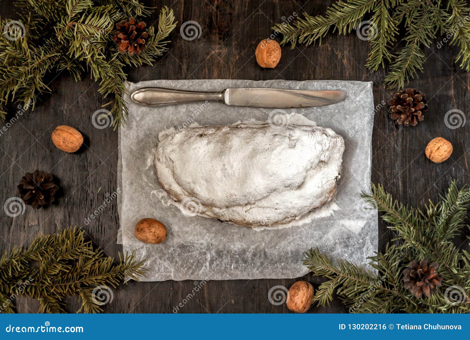Traditional German Christmas Fruit Cake Stollen on a Dark Background