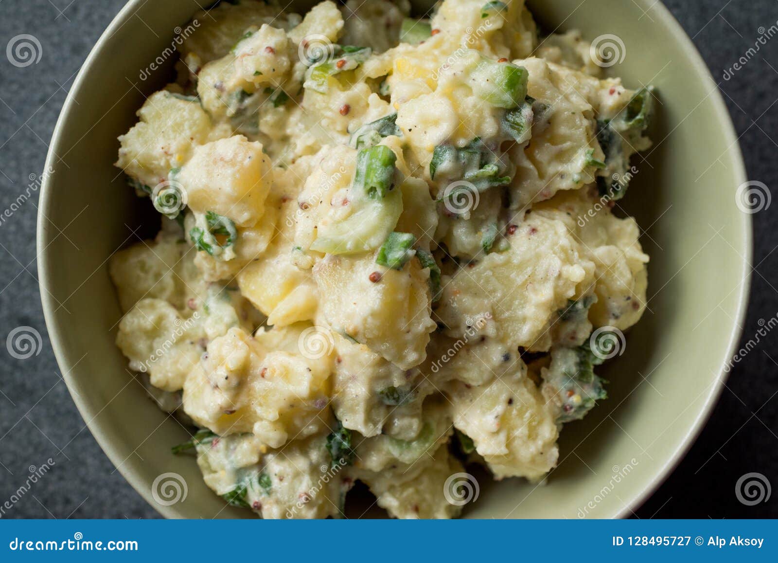 traditional german style potato salad with mayonnaise and mustard seeds / kartoffelsalat.