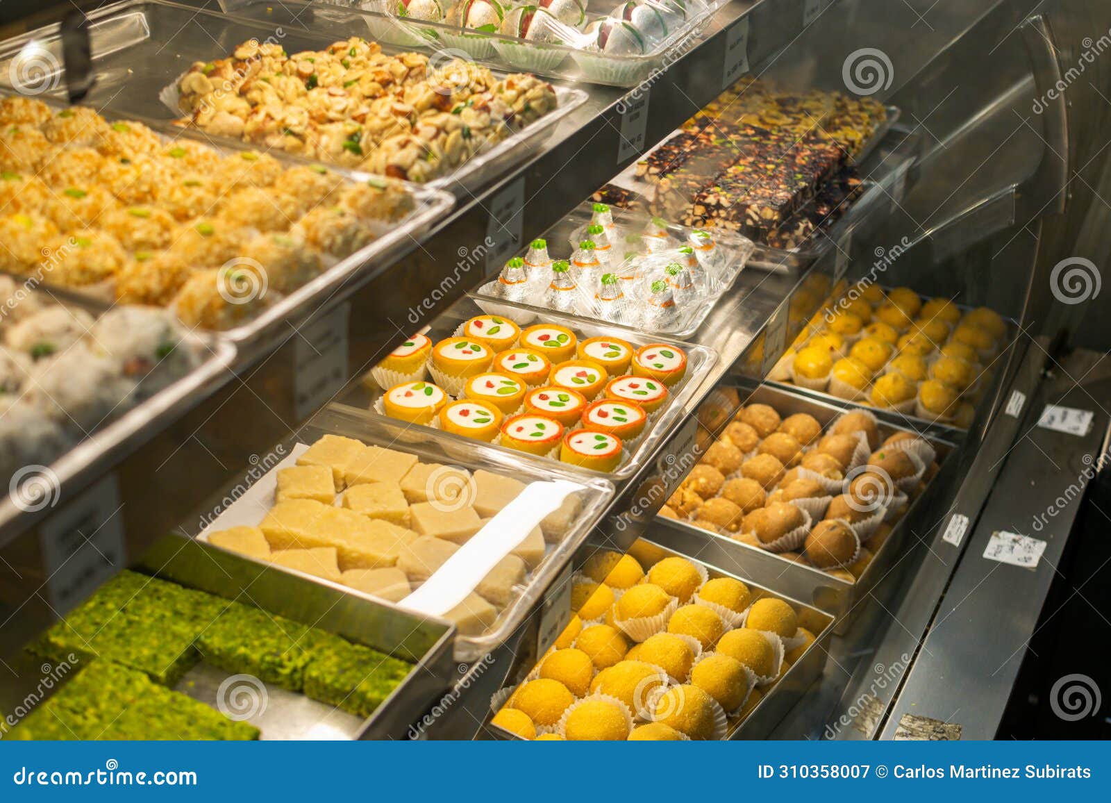 Traditional Indian Sweets and Desserts in Pastry Shop and Street Food