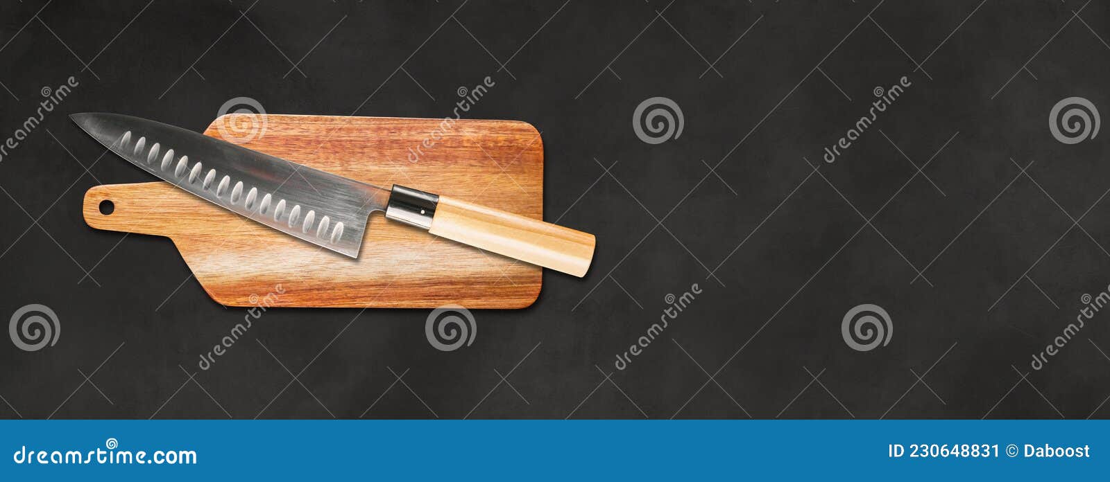 traditional japanese gyuto chief knife on a cutting board. black concrete banner