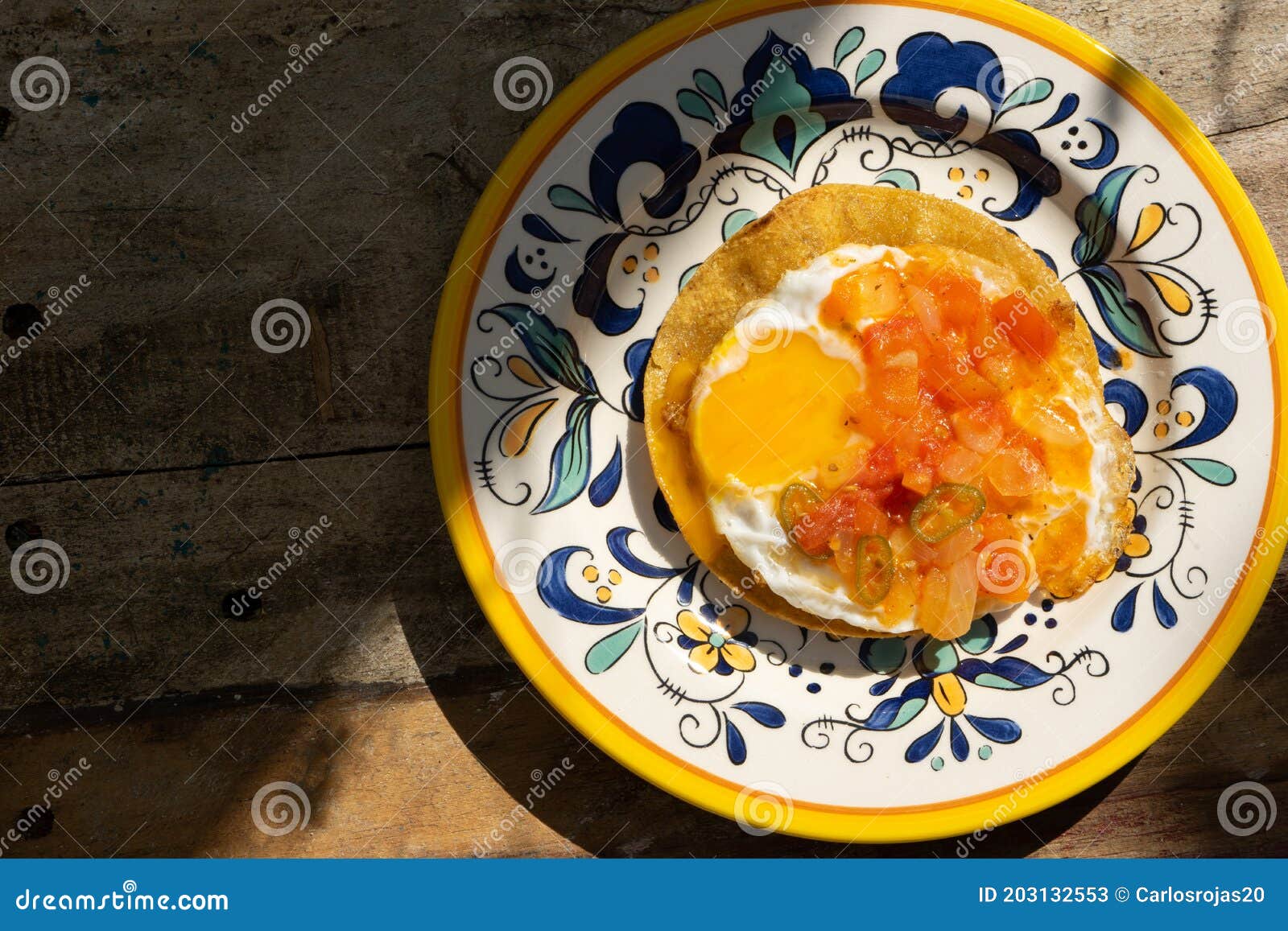 Mexican Egg Mounted on Corn Tortilla with Sauce Also Called Rancheros