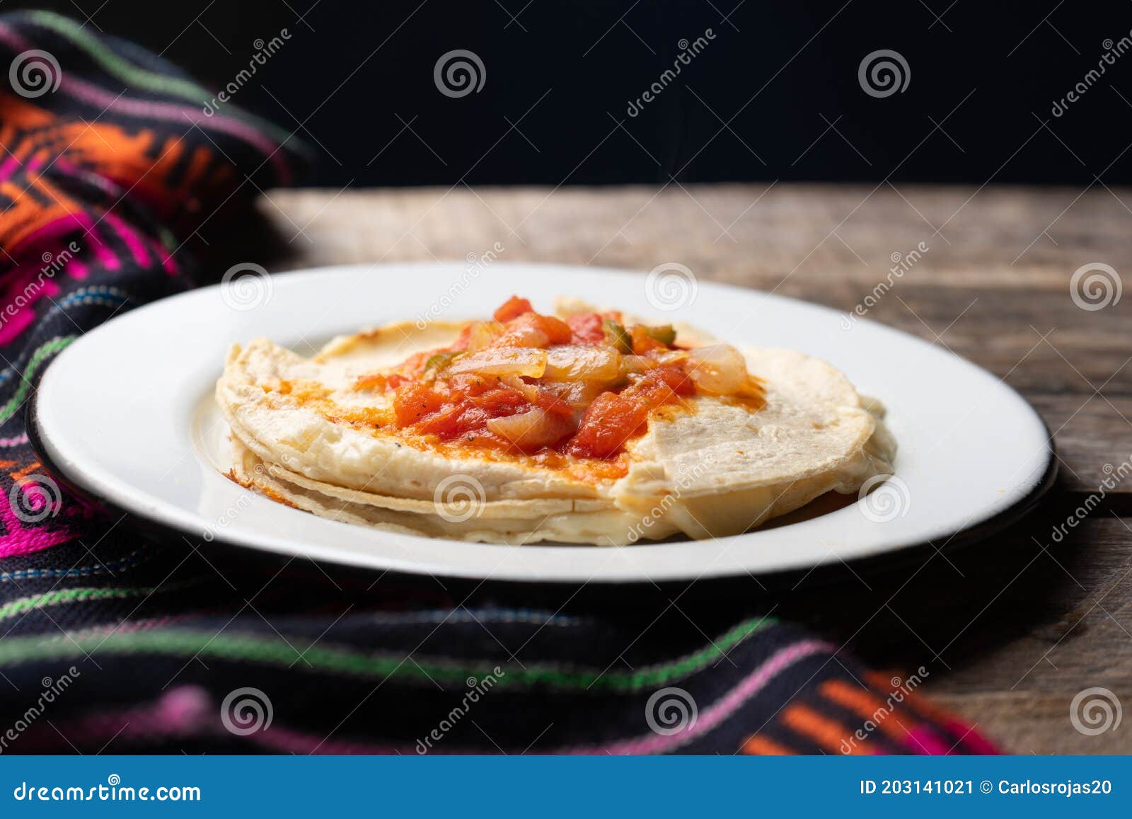 mexican quesadilla with corn tortilla and piquant sauce also called sincronizada