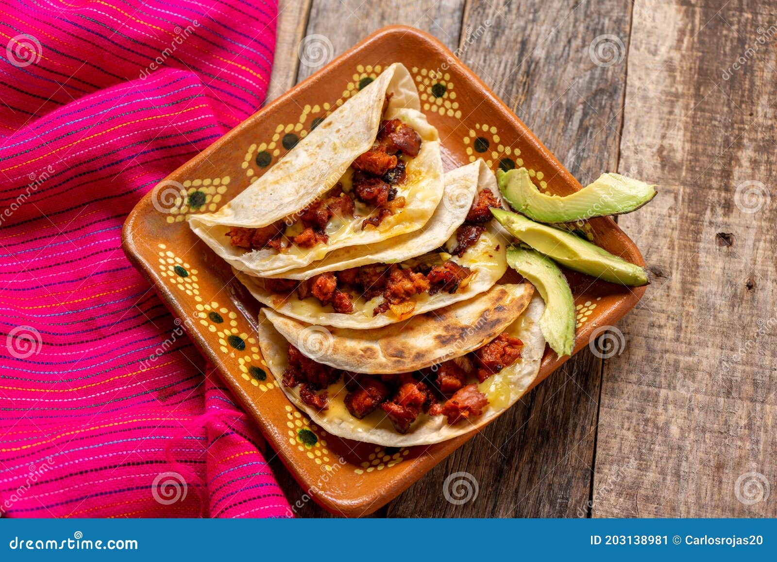 mexican quesadillas with chorizo on wooden background