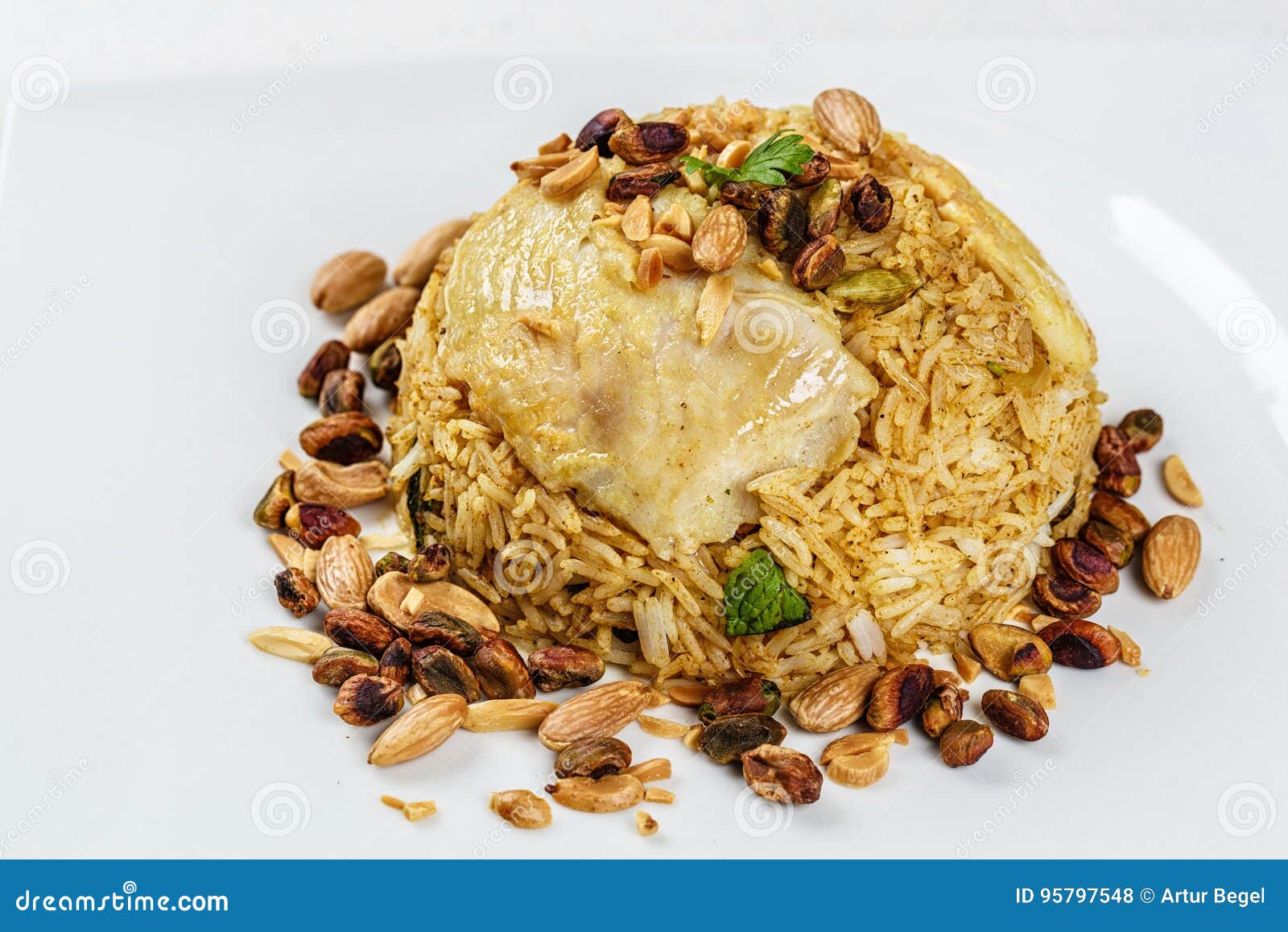 Traditional Middle Eastern Fish and Fried Rice Dish with Fried Pine