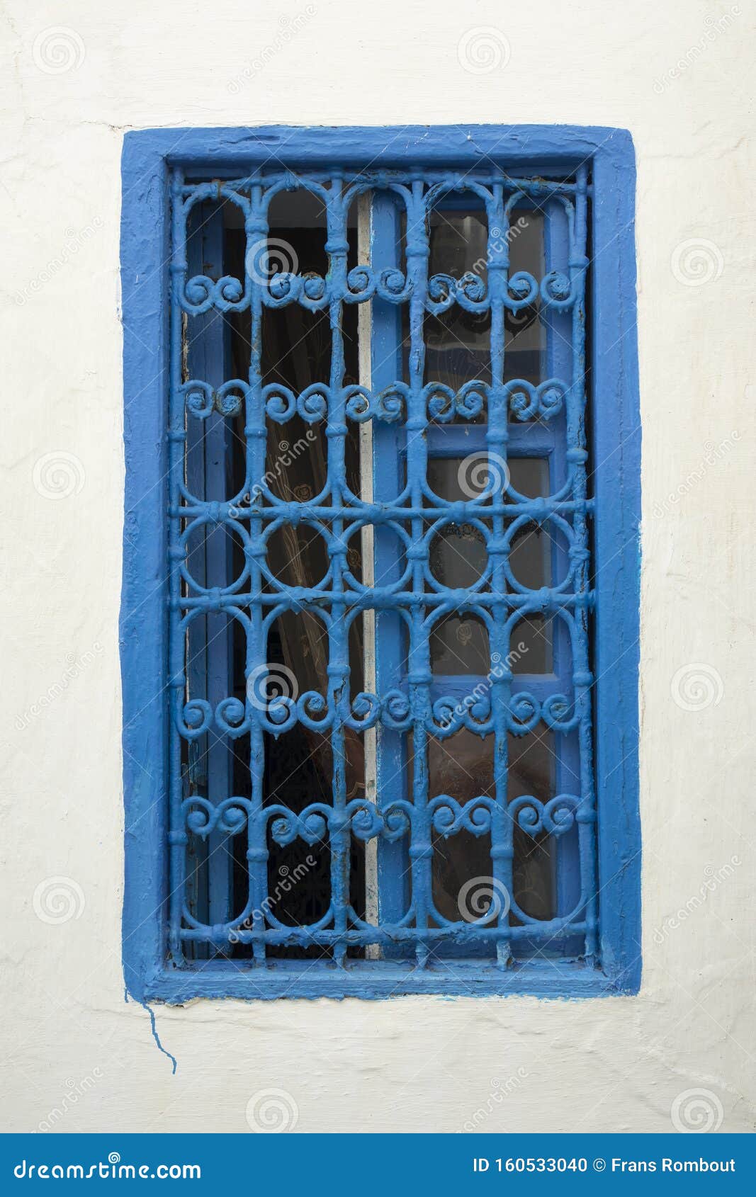 Traditional Moroccan Window Protected with Blue Metal Railing Stock ...
