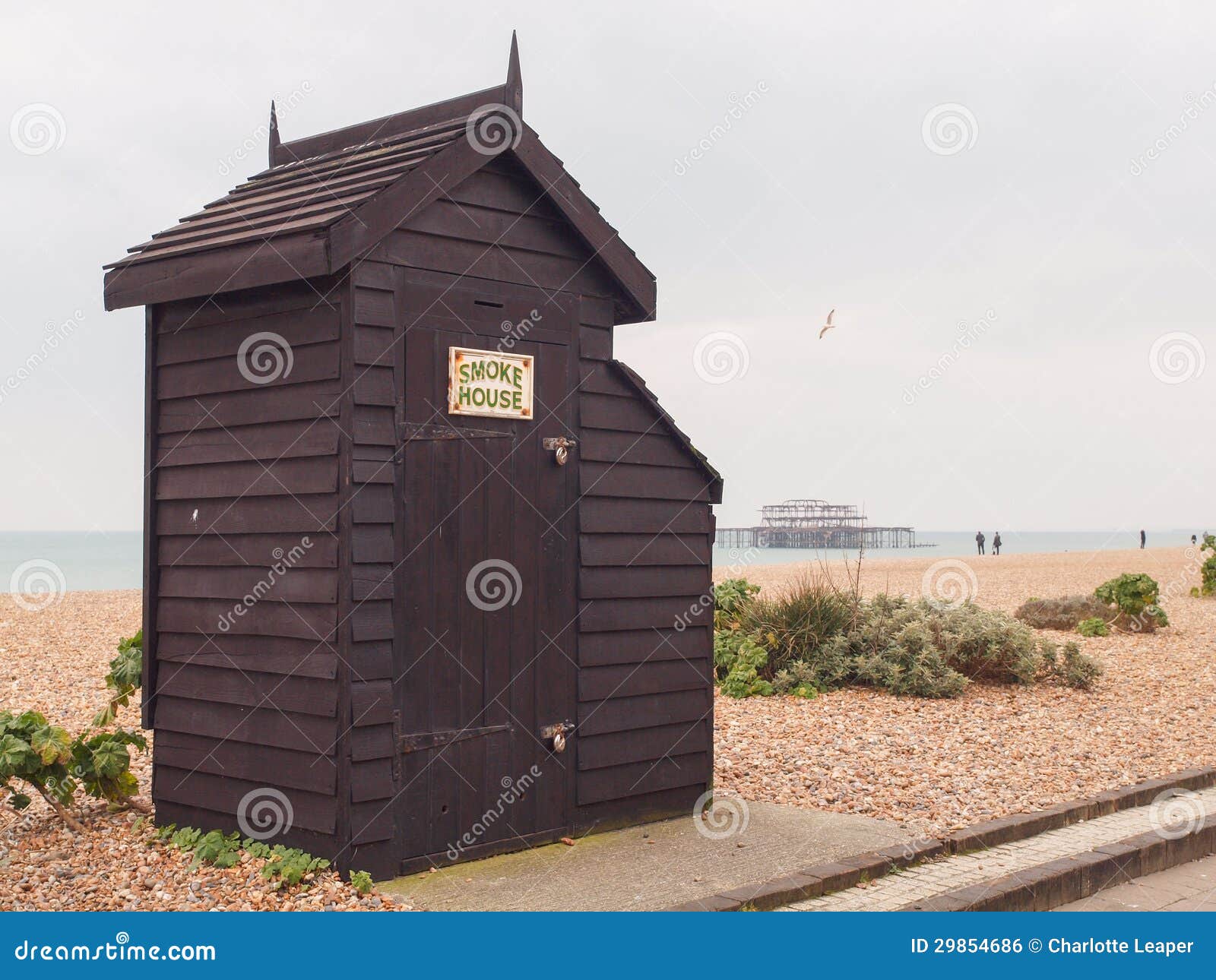 traditional old black wooden smoke house smoking fish such as mackerel front brighton beach famous ruins west pier background 29854686