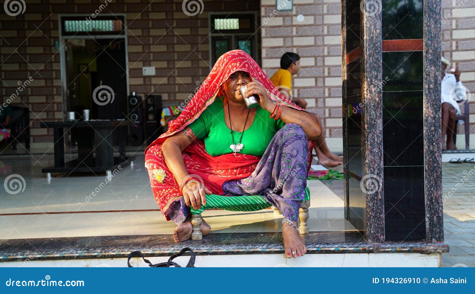 In Traditional Ornamented Dress, Rajasthani Old Woman Taking Tea ...