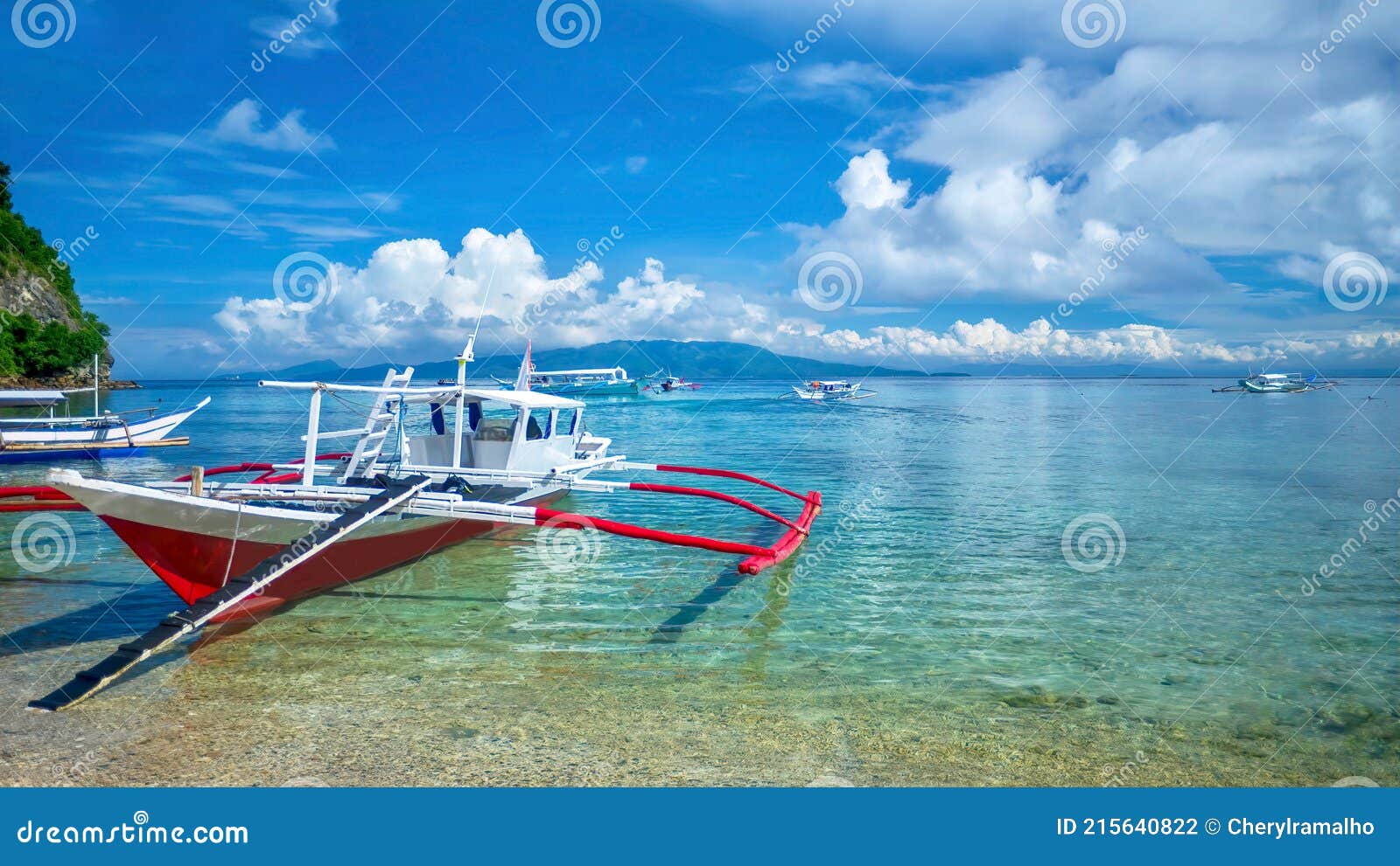 traditional outrigger boats on a tropical island in the philippines.