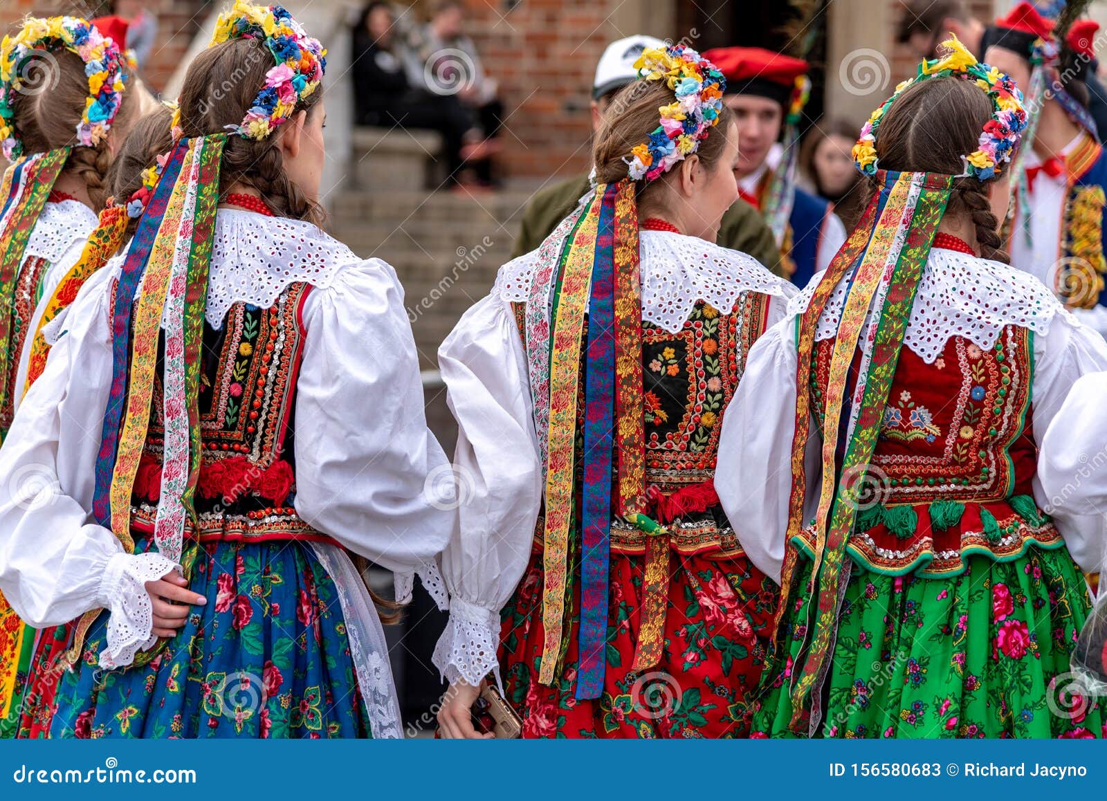 Traditional Polish Folk Costumes On Parade In Krakow Main Market Square ...