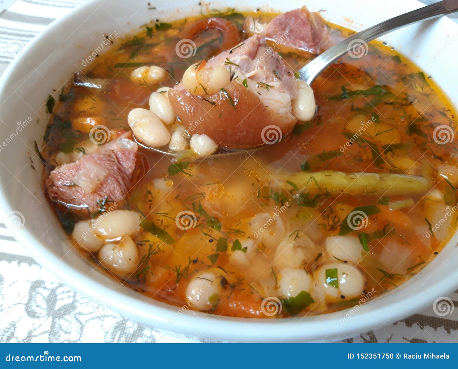 Traditional Romanian Bean Soup With Smoked Pork Meat Stock Photo