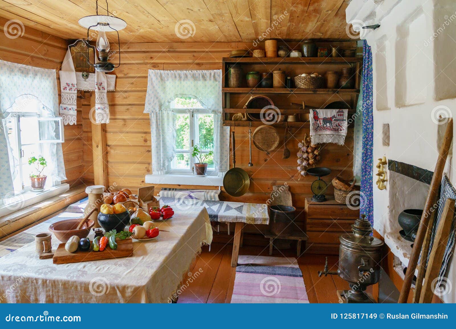 Traditional Russian Cottage With Oven And Crockery Interior