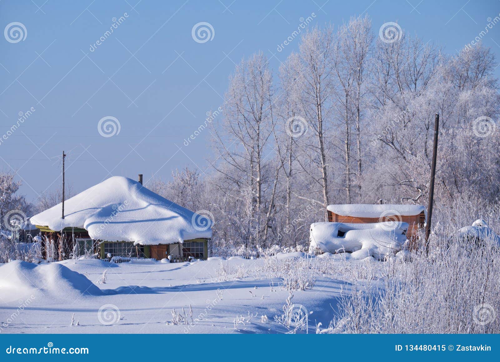traditional russian country house izba in village talitsa under winter snow
