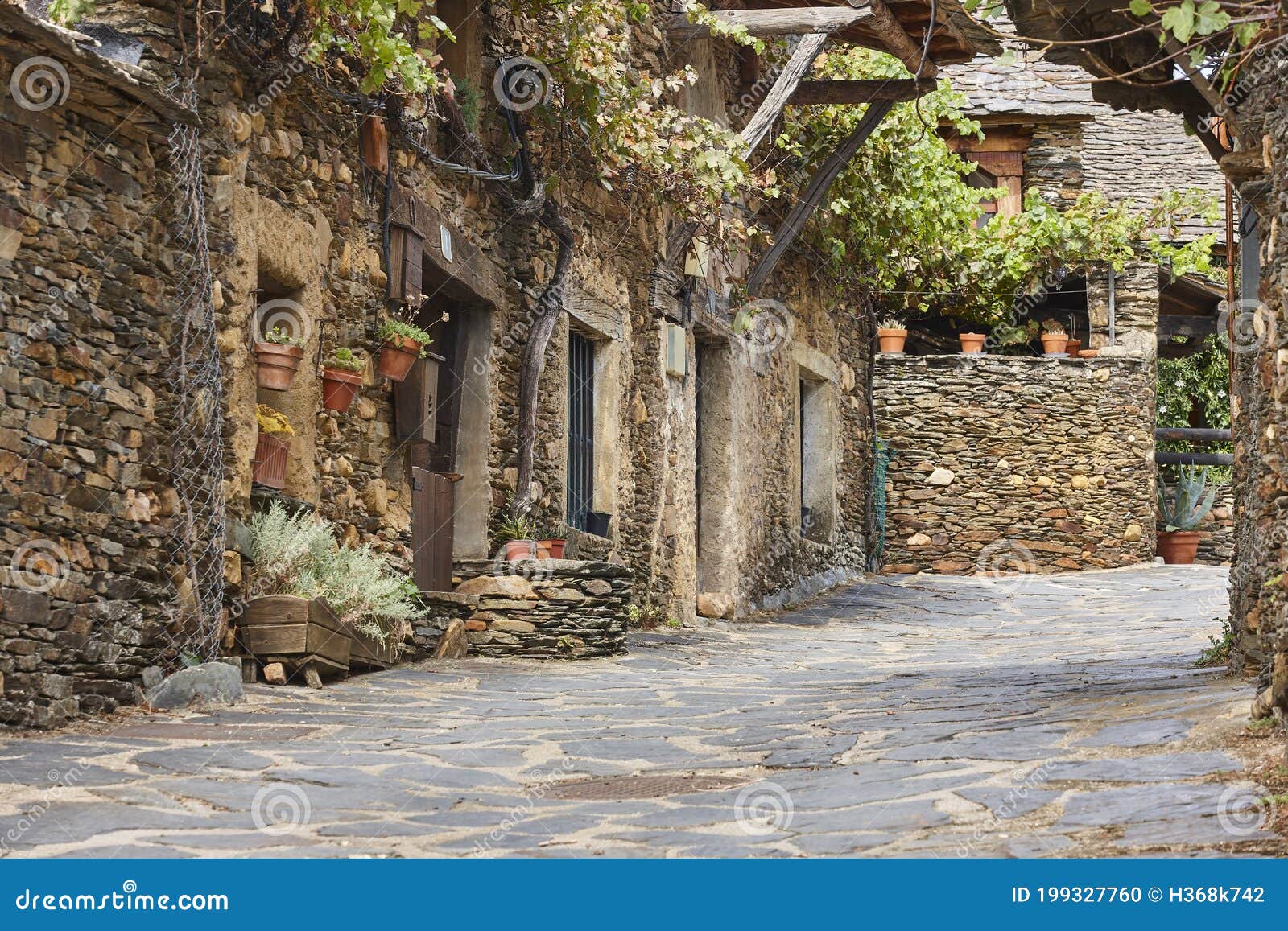 traditional slate stone village roblelacasa. black architecture. guadalajara. spain