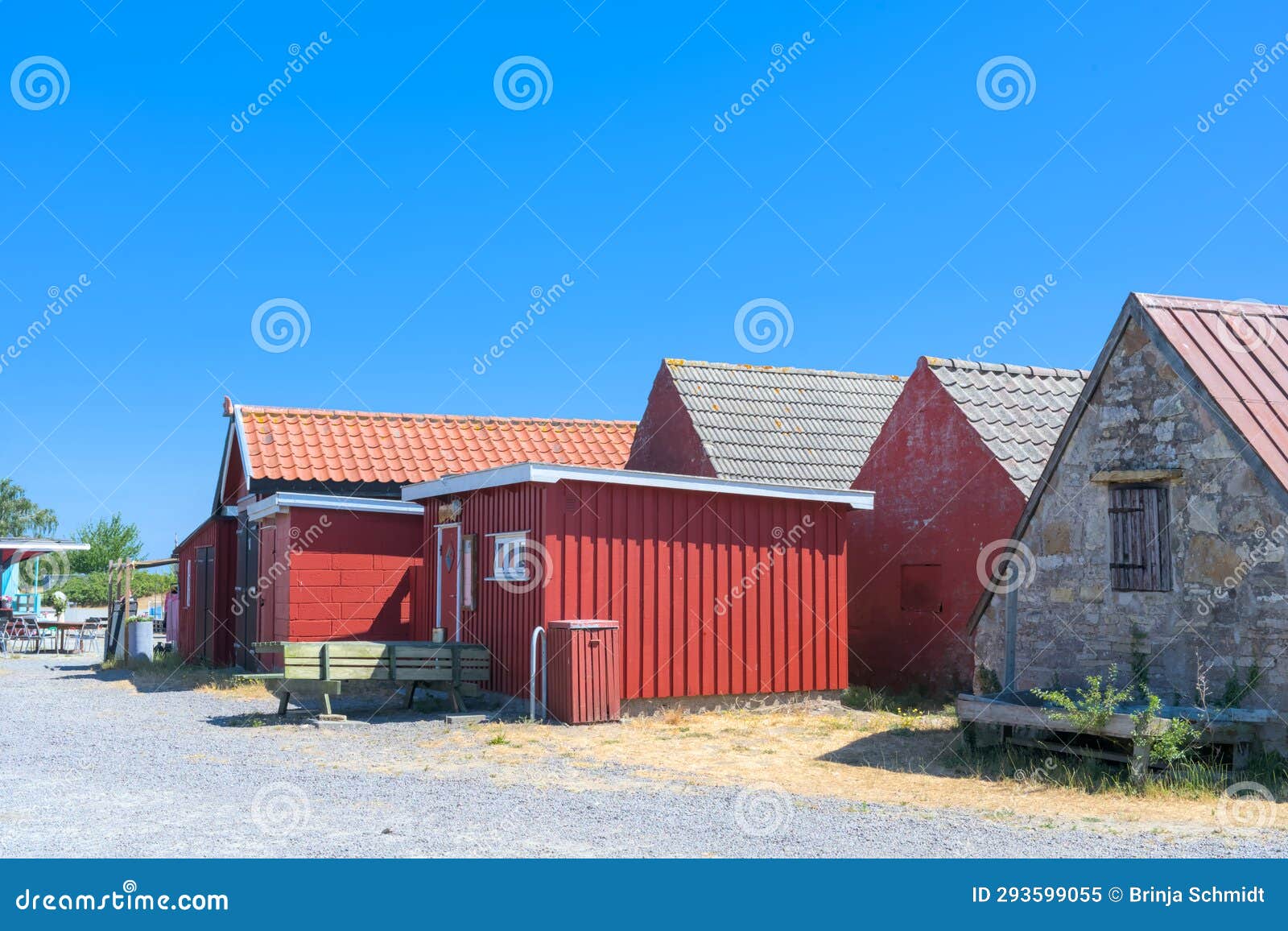 a traditional small,red,danish framehouse in summer in bornholm with blue sky
