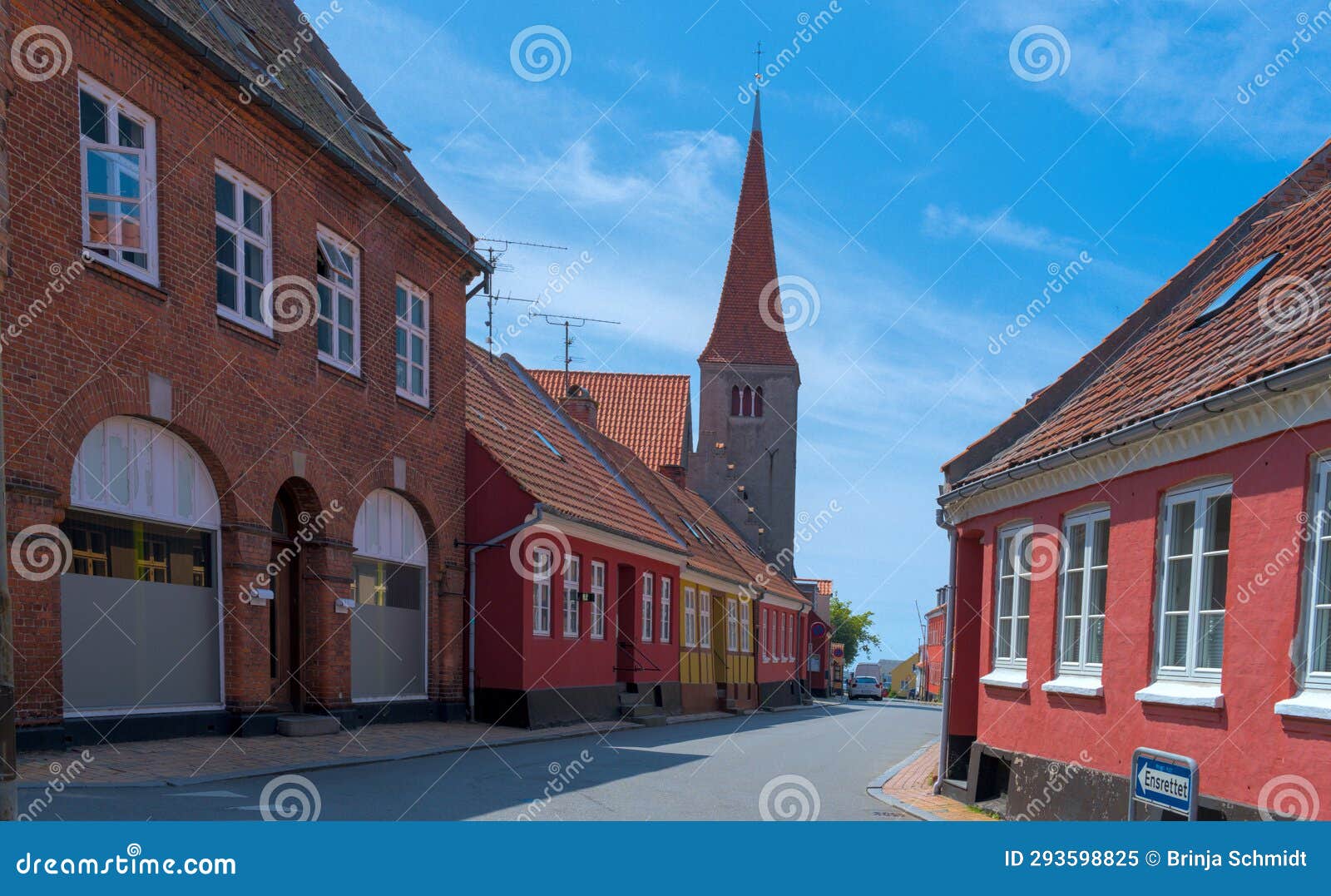 a traditional small,red,danish framehouse in summer in bornholm with blue sky