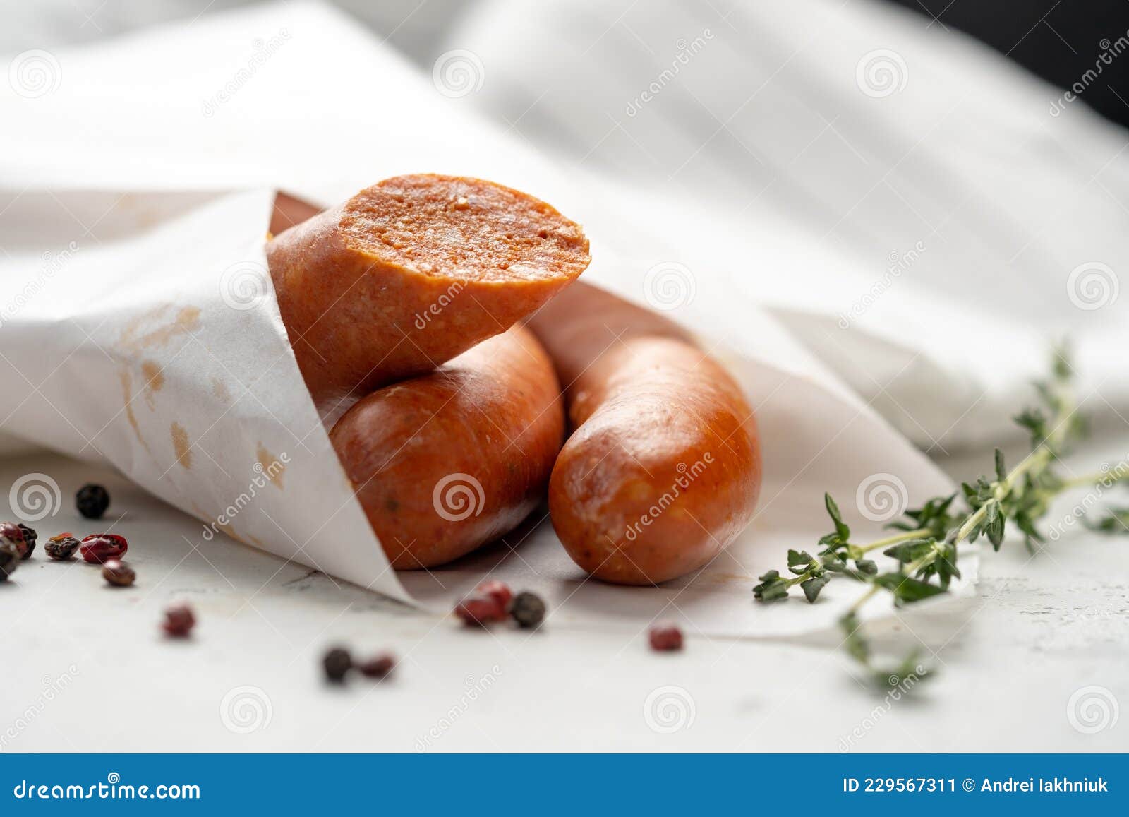 traditional spanish chistorra sausages wrapped in paper with pepper