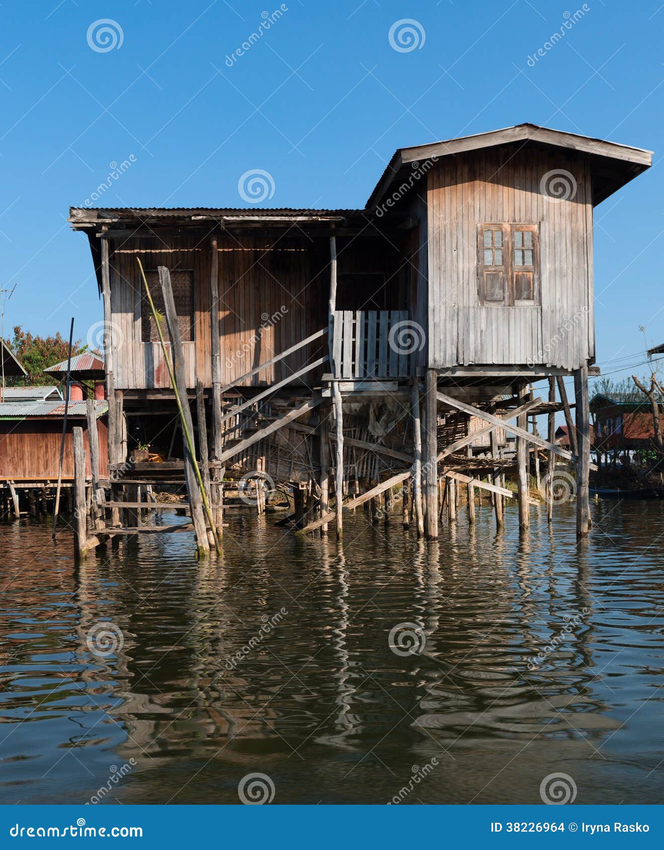 Traditional Stilts House in Water Under Blue Sky Stock Photo Image of