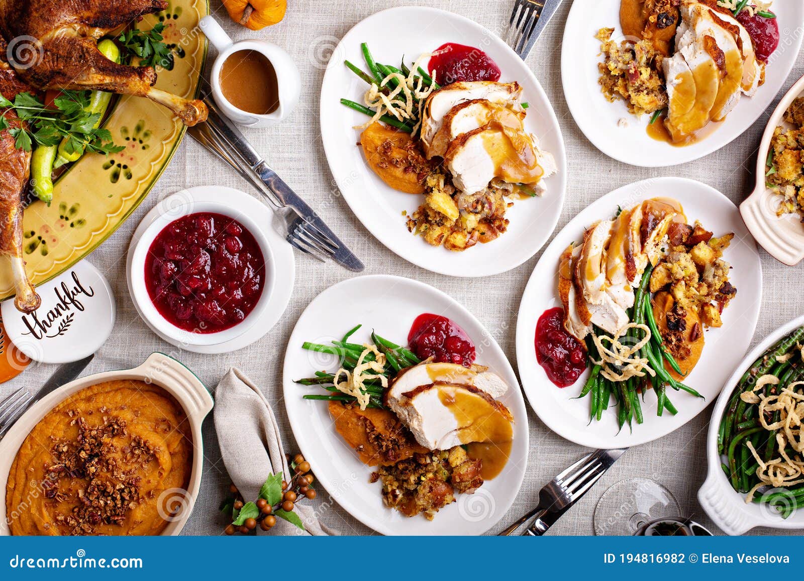 Traditional Thanksgiving Plates With Turkey And Sides Stock Photo traditional-thanksgiving-plates-with-turkey-and-sides-stock-photo