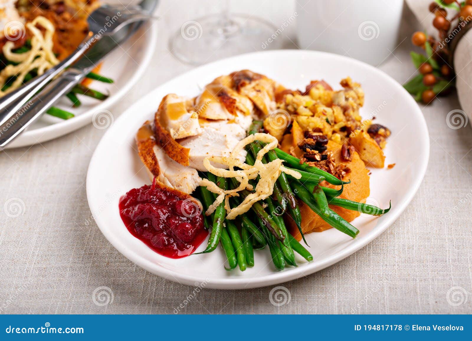 Traditional Thanksgiving Plates With Turkey And Sides Stock Photo traditional-thanksgiving-plates-with-turkey-and-sides-stock-photo