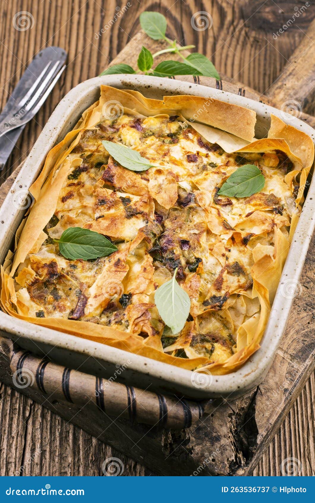 Traditional Turkish Börek Pastry with Feta Cheese, and Vegetable in a Backing Casserole Stock