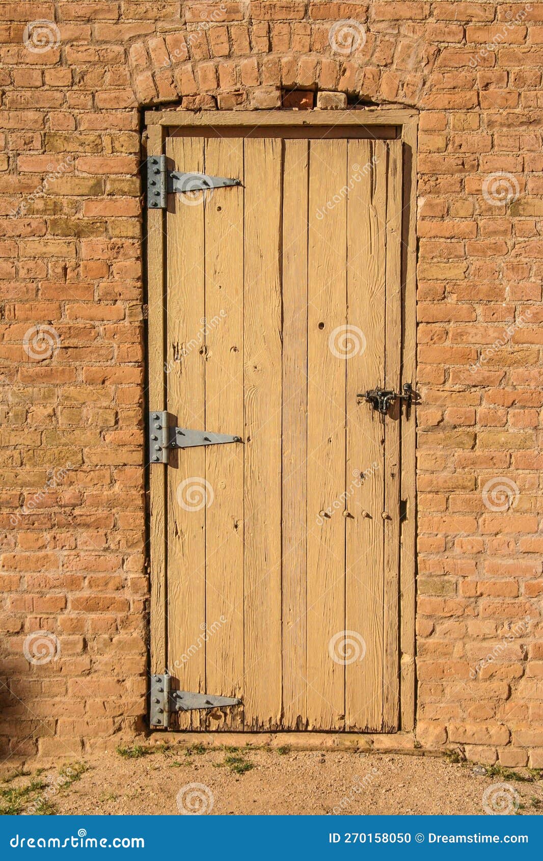 Traditional Wooden Door in a Brick Wall Stock Photo Image of wild