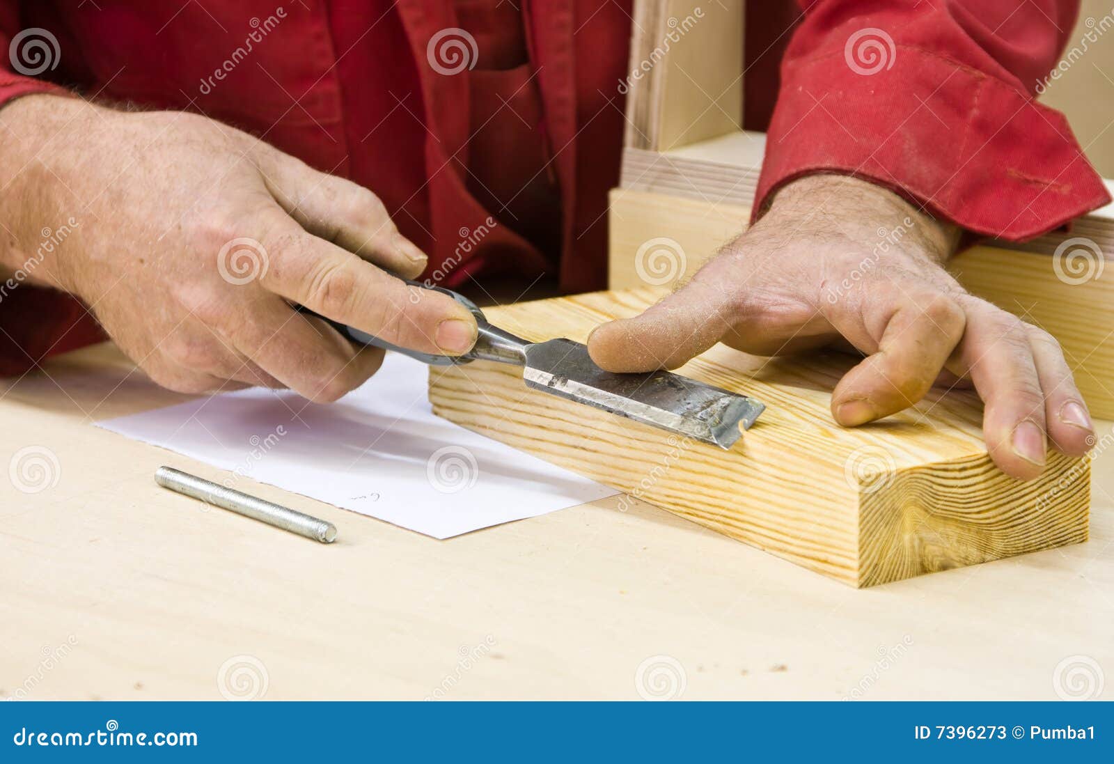 traditional woodworker using chisel