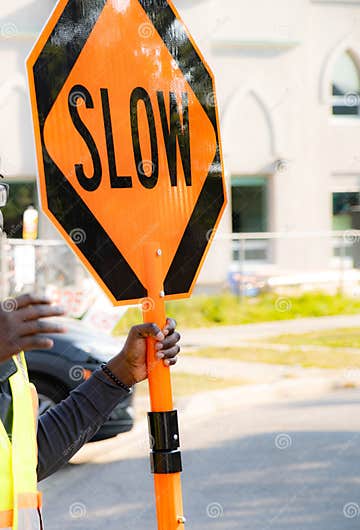 Traffic Control With Stop Slow Sign According To Construction Plan