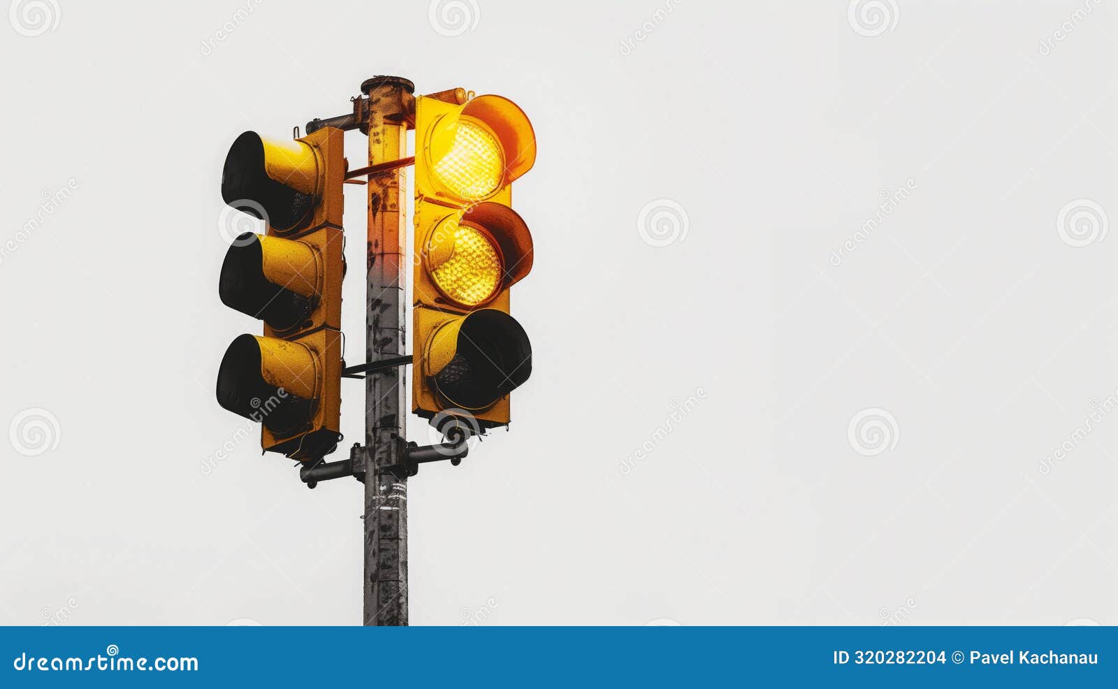 Traffic Light with Two Yellow Lights Illuminated on Top Stock Photo