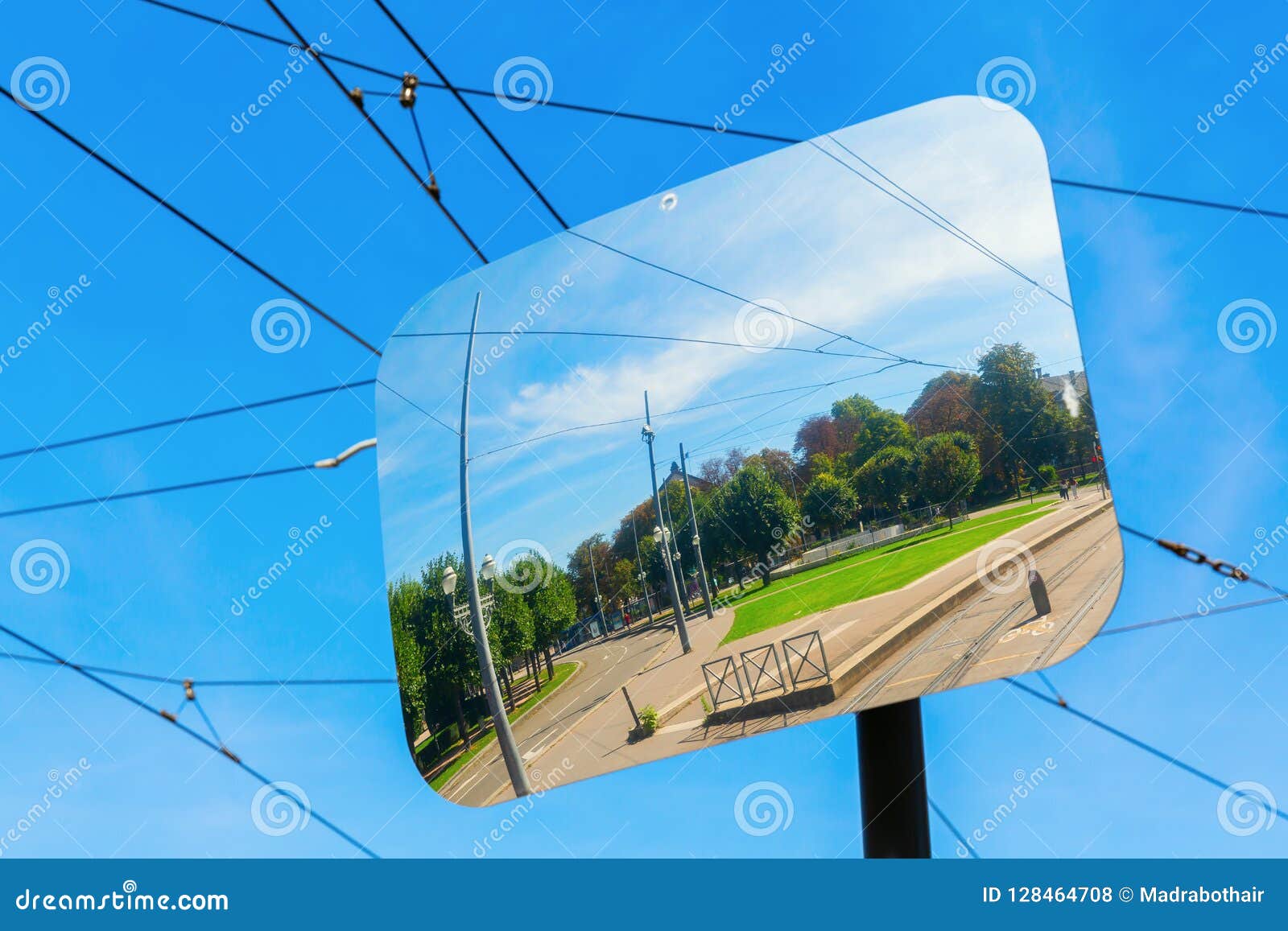 traffic mirror reflects the place de la republique in strasbourg, france