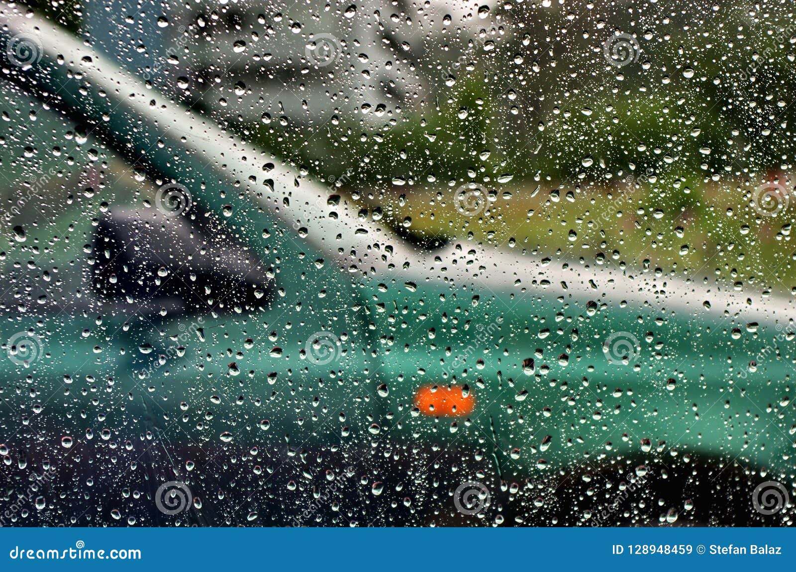 Traffic in Rainy Day with View through Car Window with Rain Drops ...