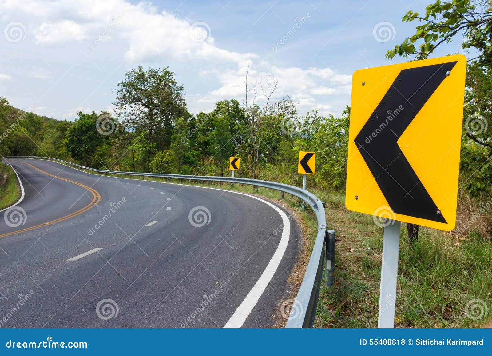 Dangerous turns, triangle warning traffic sign near rural road Stock Photo  - Alamy