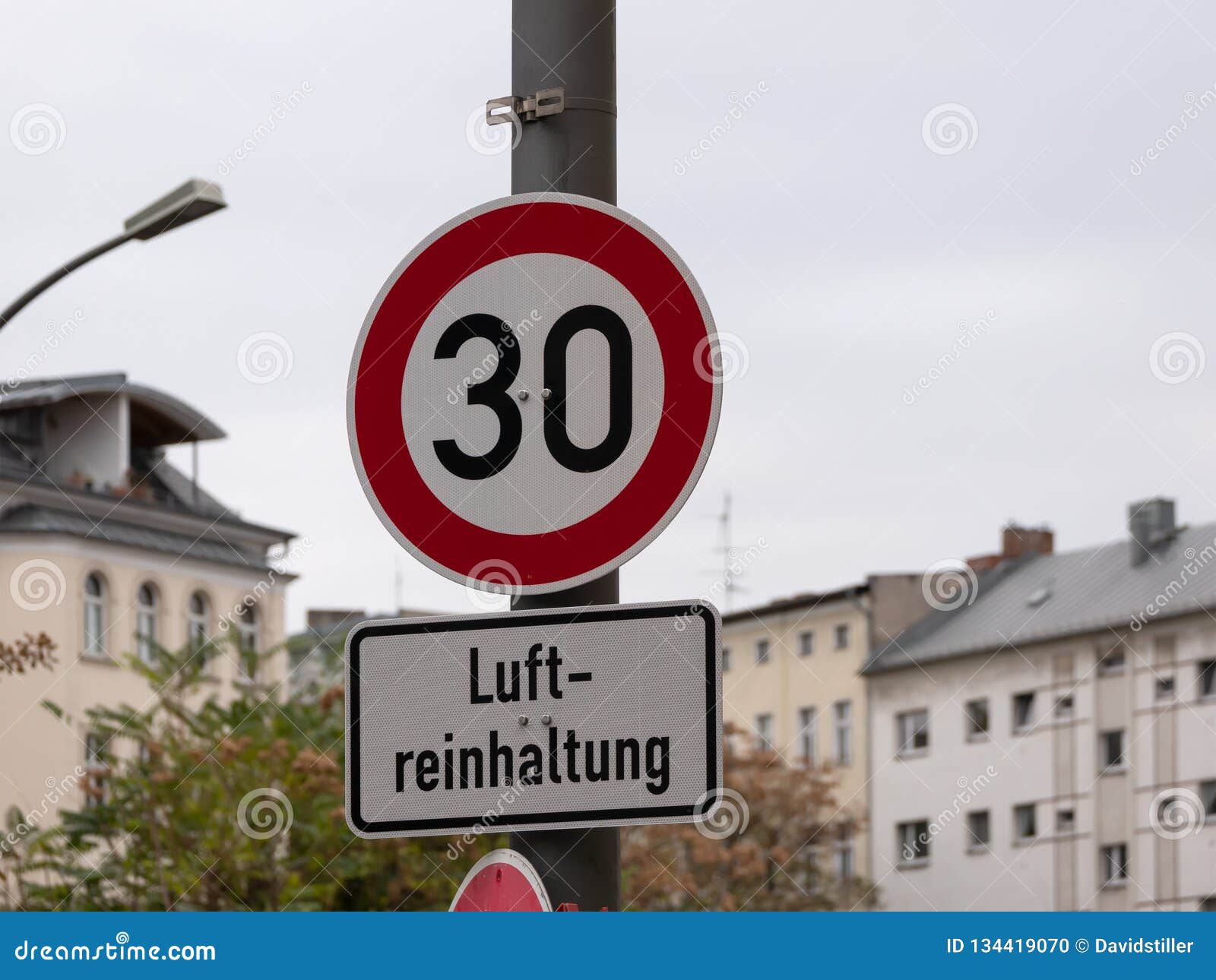 traffic sign speed limit 30 for luftreinhaltung, meaning air pollution control in german, in berlin, germany