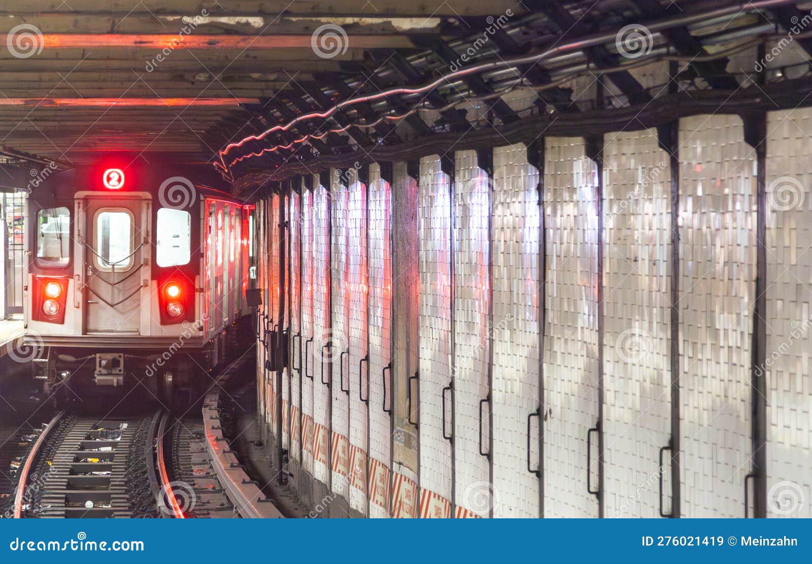 train arrives in the underground station in new york