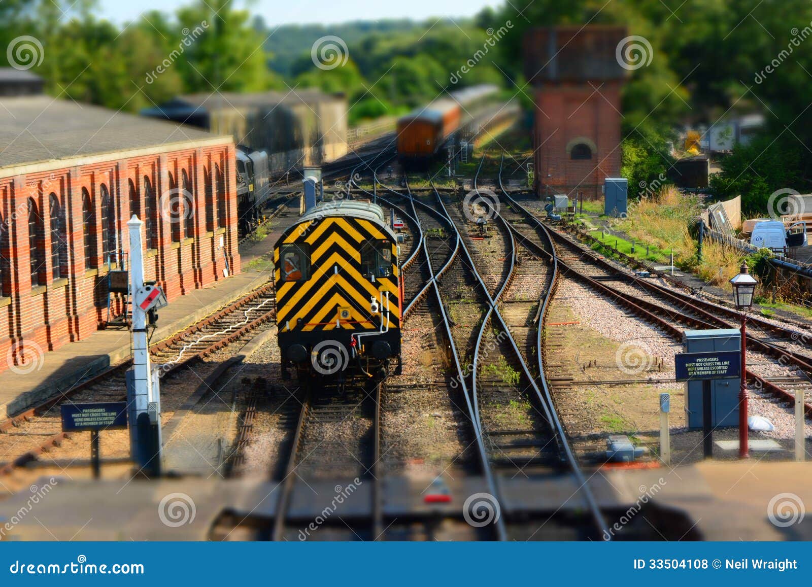 train on railway track. tilt shift royalty free stock