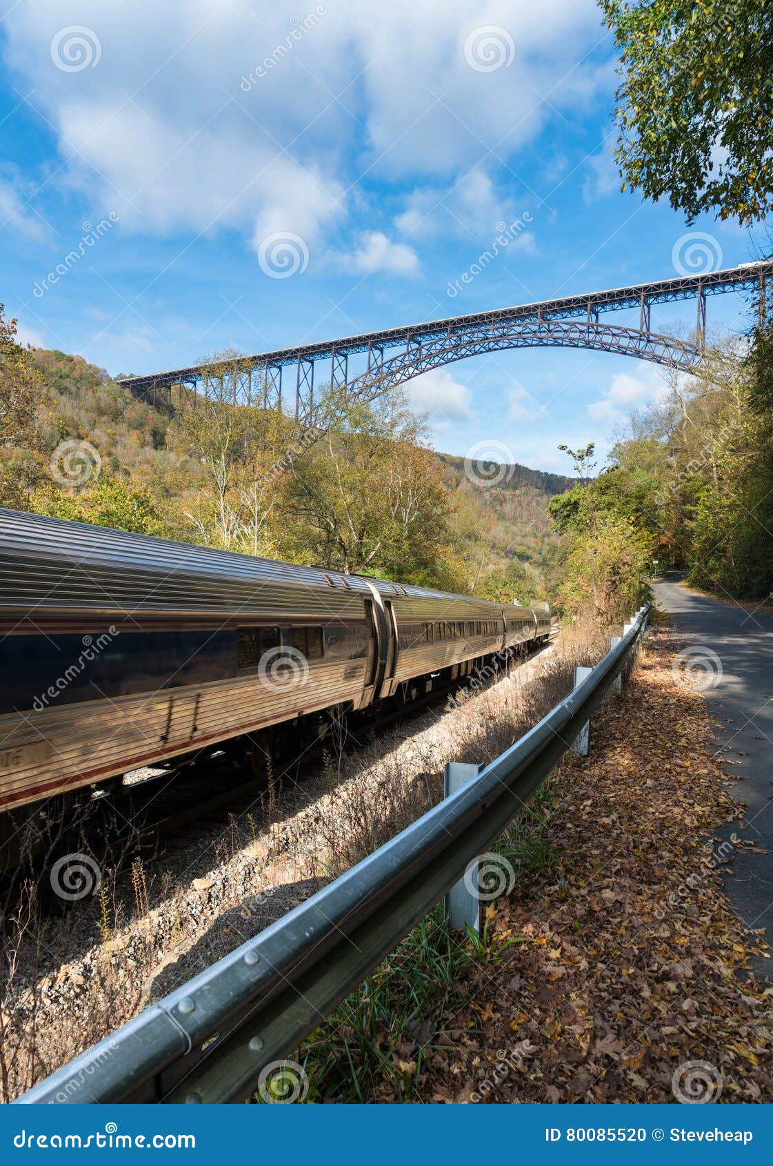 Train Runs Under the New River Bridge in West Virginia Stock