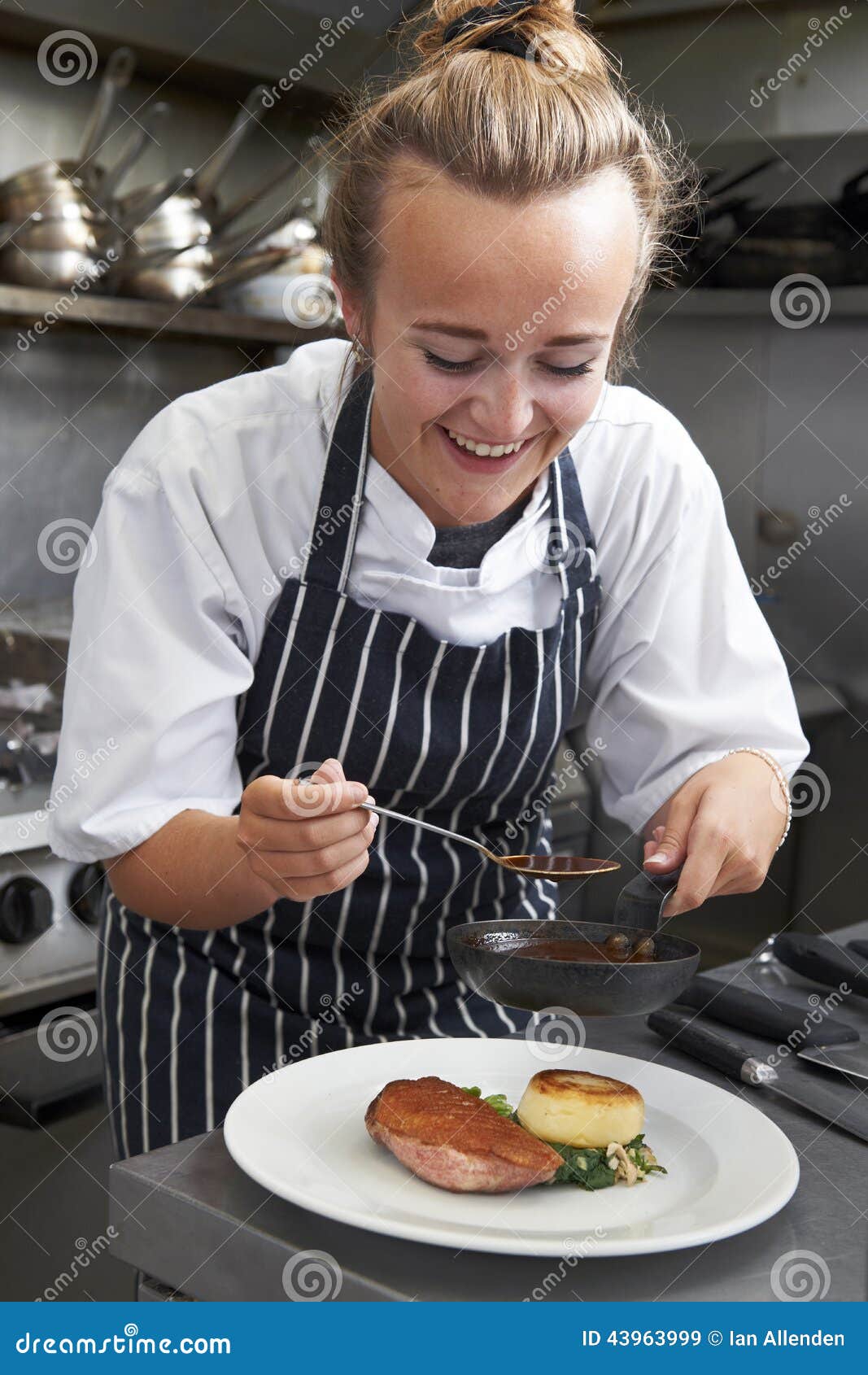 Trainee Chef Working in Restaurant Kitchen Stock Image - Image of