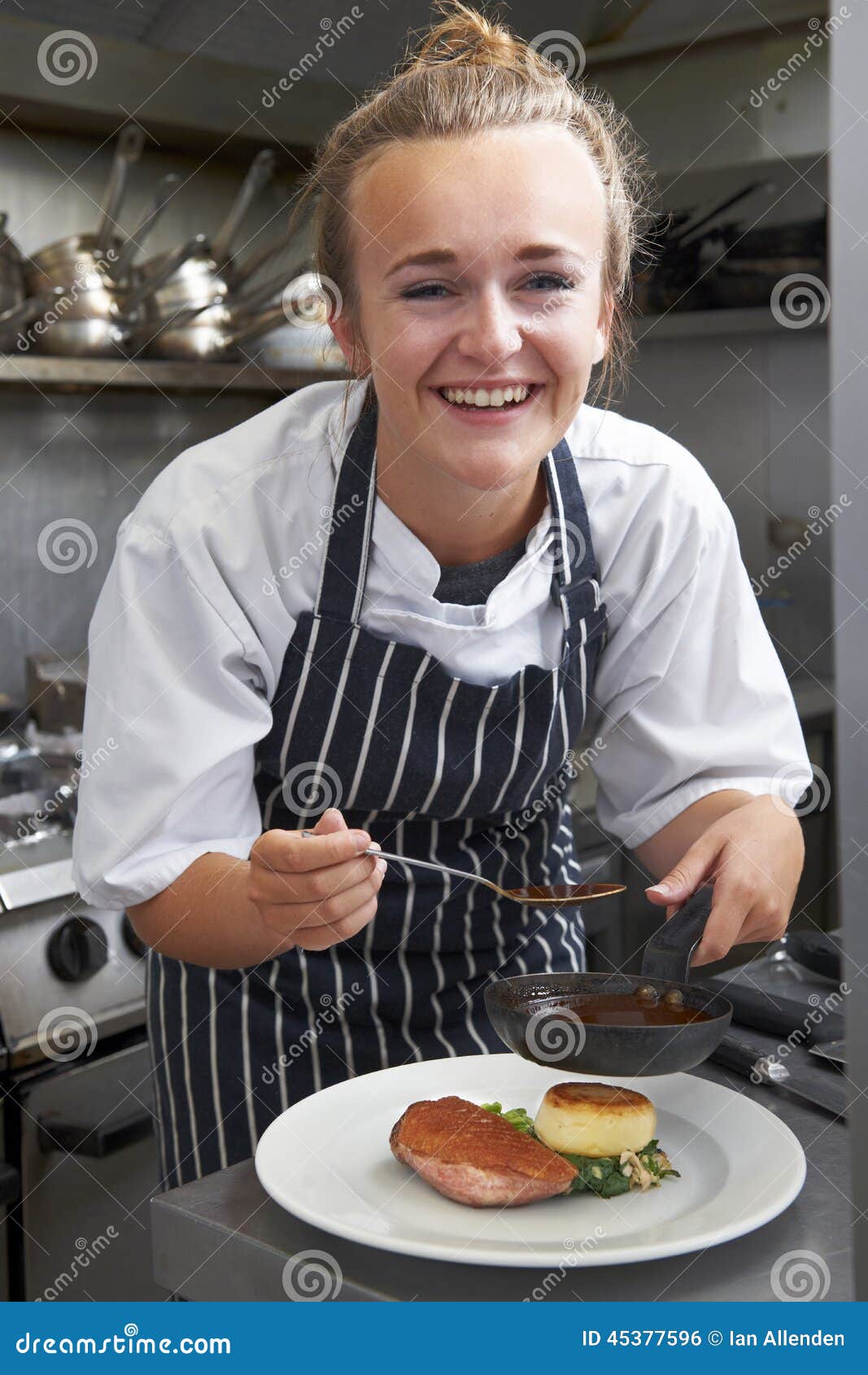 trainee chef working in restaurant kitchen