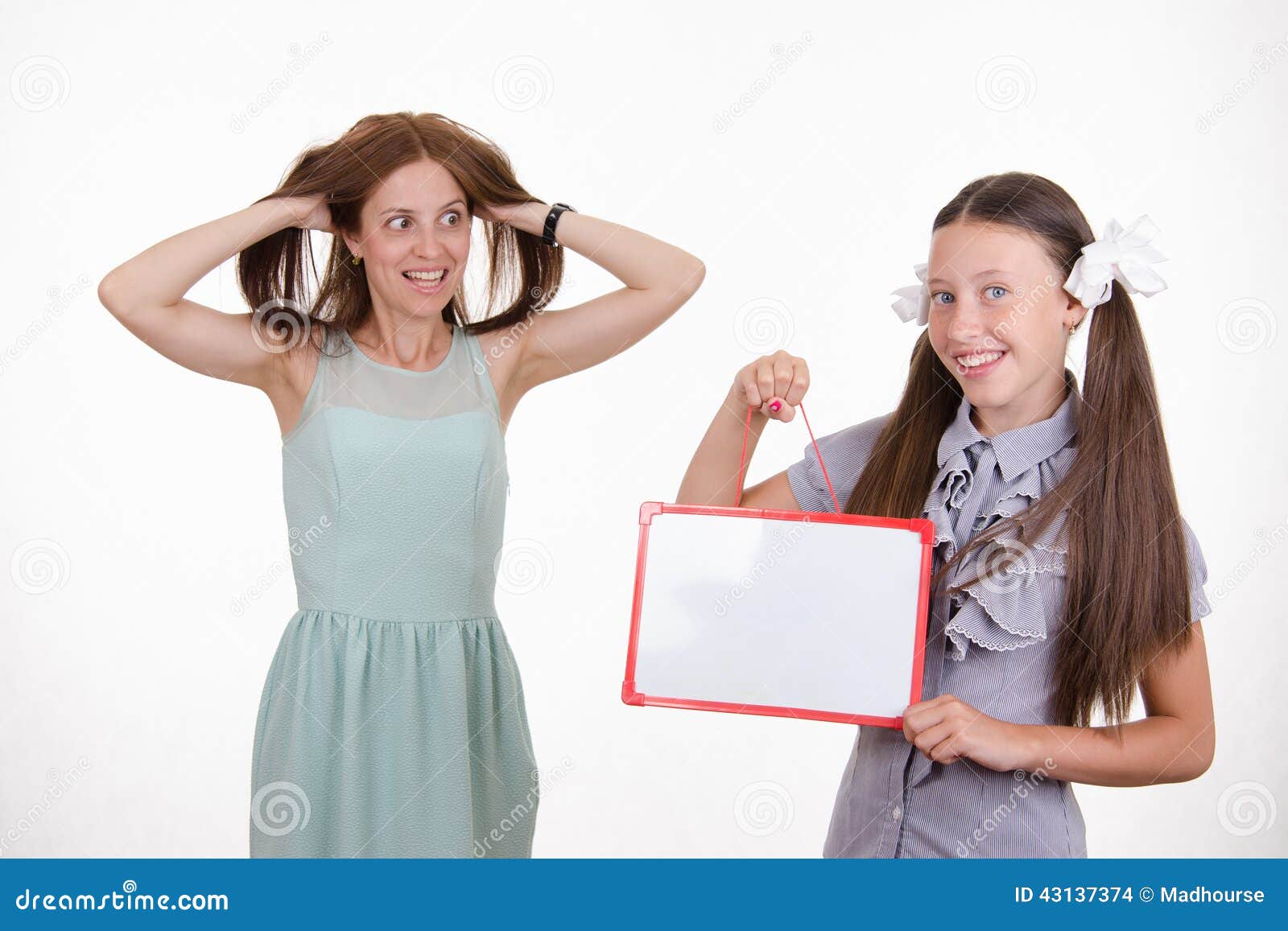 trainee with a sign mocks pupil