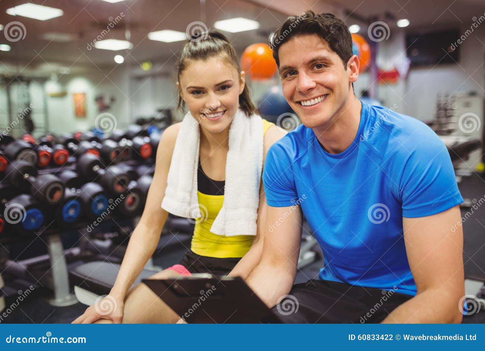 Trainer and Client Discussing Her Progress Stock Photo Image of