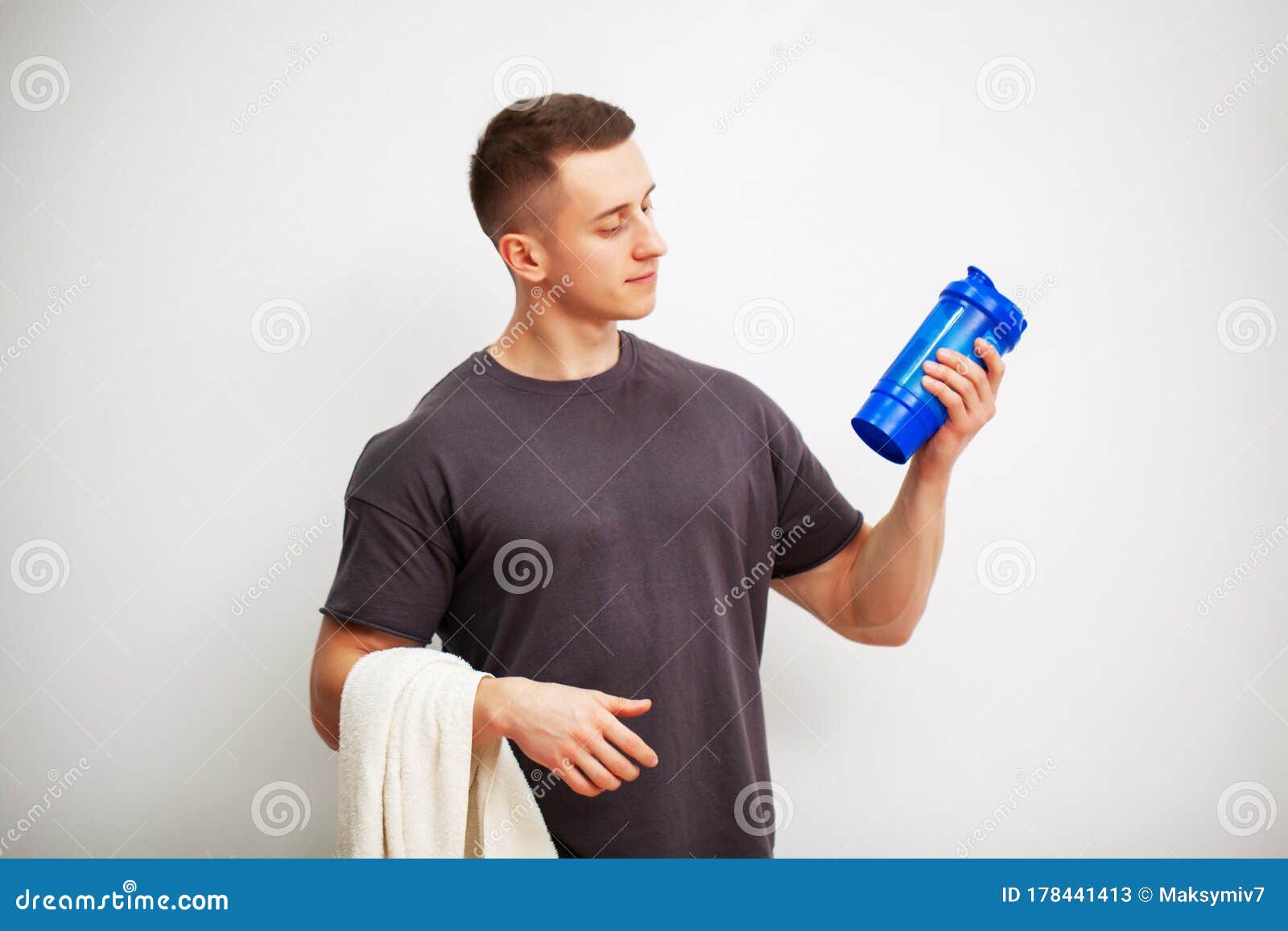 Trainer Prepares a Protein Shake in the Shaker after Training. Stock