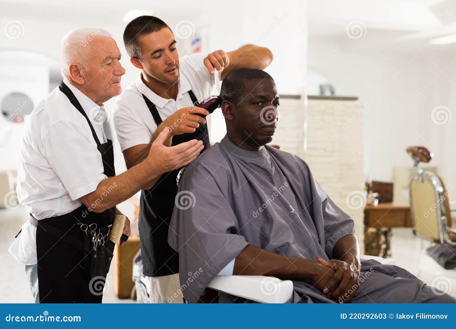 Aged Barber Teaching Apprentice To Male Haircut Stock Image - Image of  head, business: 220292603