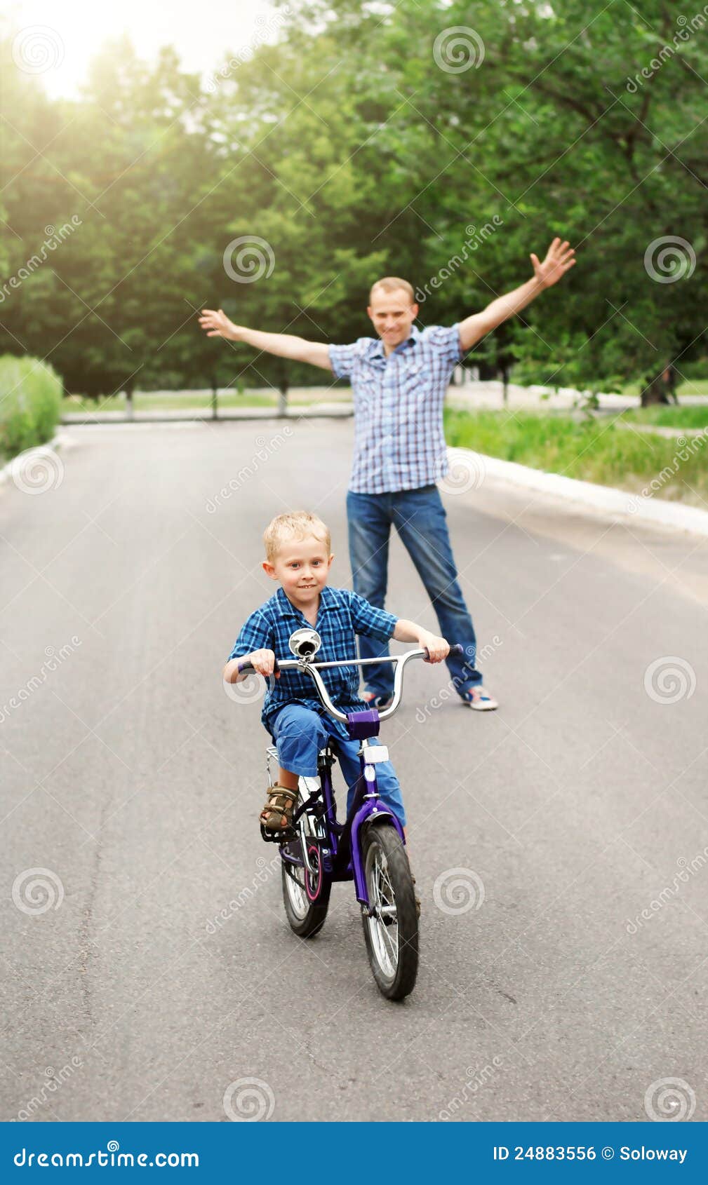 Training to ride a bicycle stock photo. Image of active 24883556