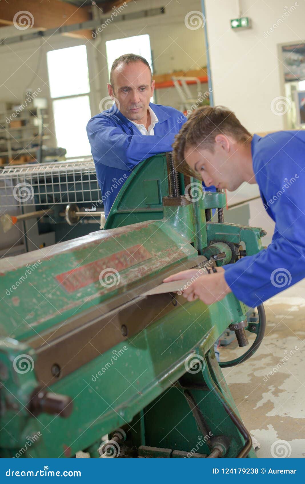 Training Using Machine Supervisor Watching Stock Photo Image of