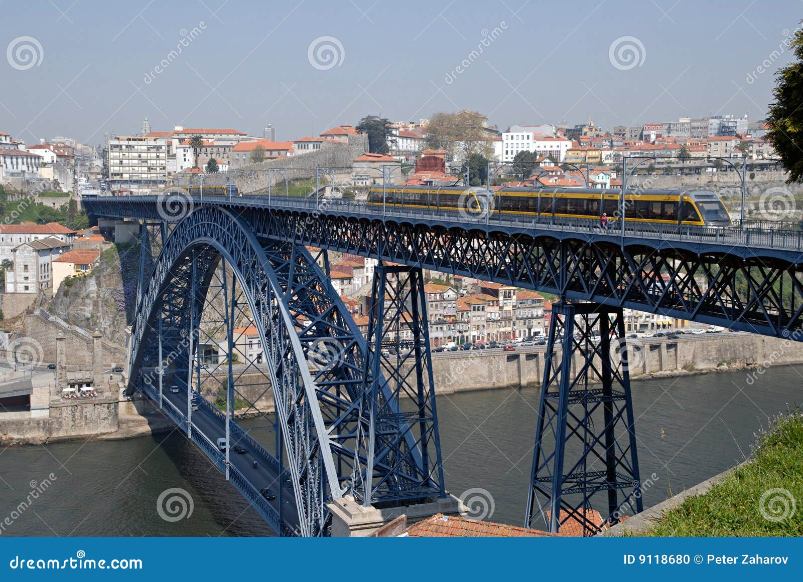 Tram on the bridge. Porto. Tram on the bridge of Luis I over Douro river, Porto. Bridge was made by design oà ‡ustaf Eiffel. Point of interest in Portugal.