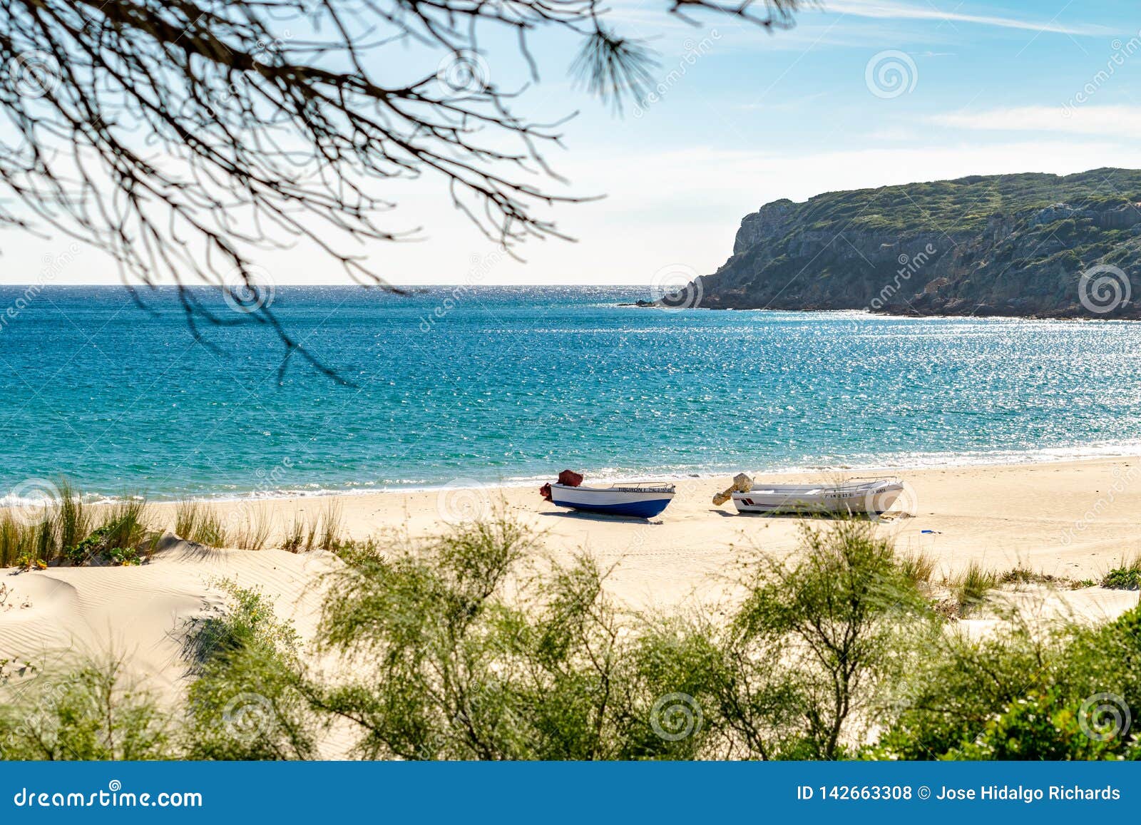 tranquil beach scene in bolonia, spain