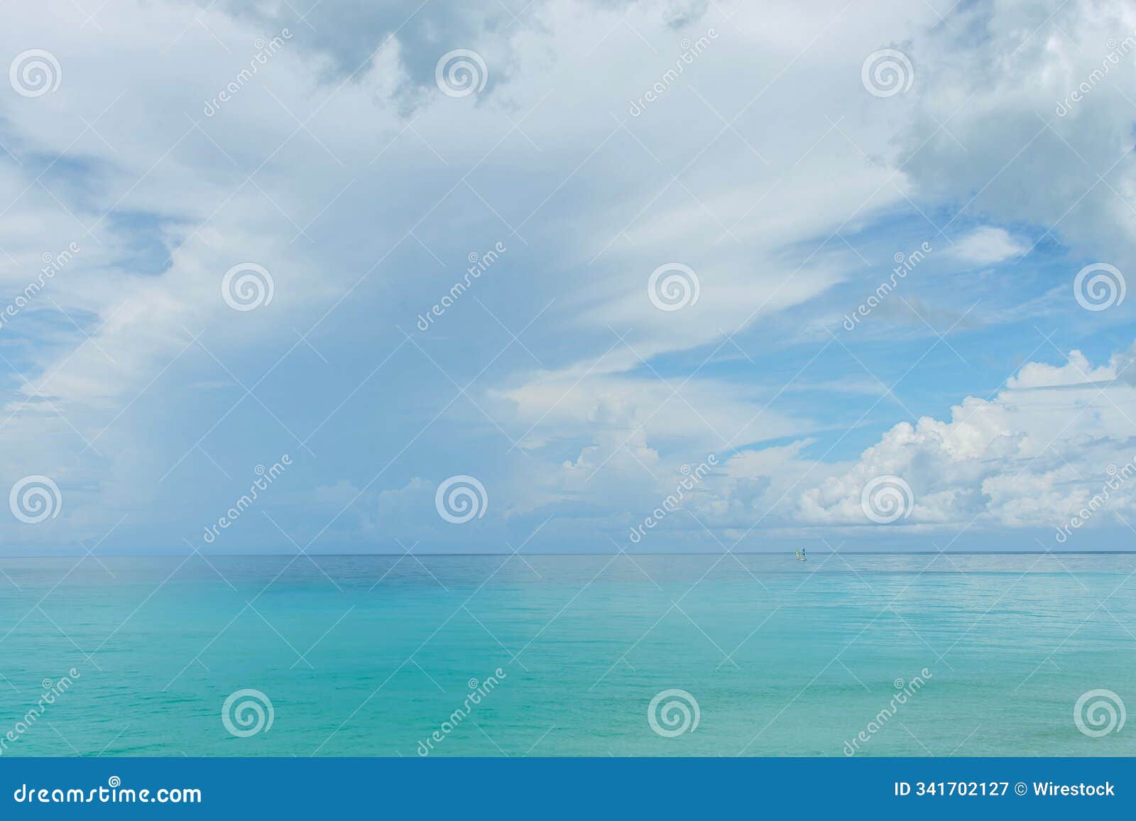 tranquil seascape with paddleboarder